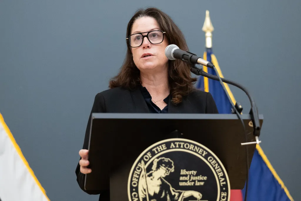 New Jersey Attorney General Jennifer Davenport speaks at a news conference.