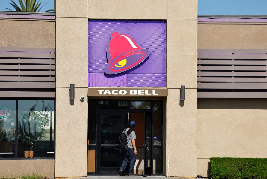 A person entering a Taco Bell restaurant in Pasadena, California.