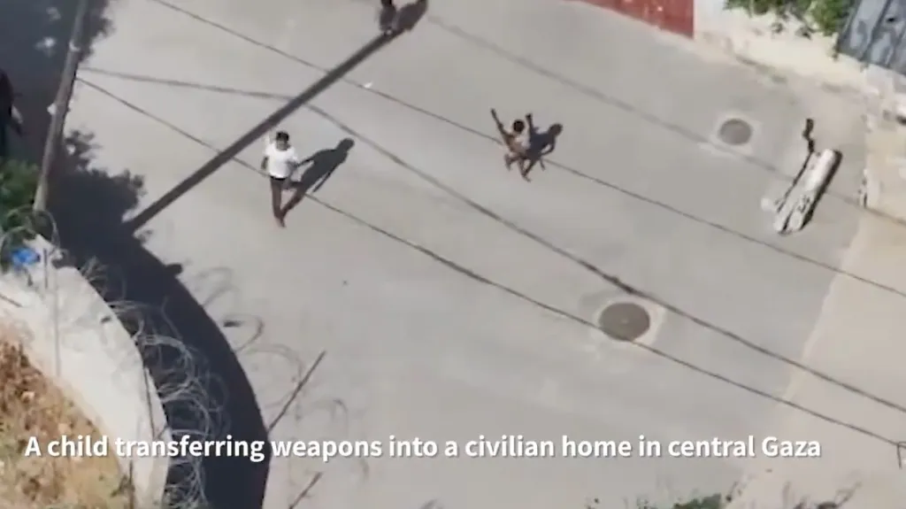 Drone footage showing a child transferring weapons into a civilian home in central Gaza.