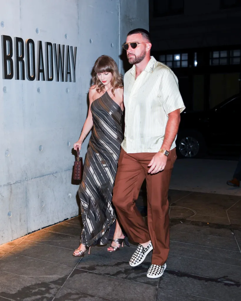 Taylor Swift in a metallic striped dress with a matching handbag and Travis Kelce in a striped shirt, brown trousers, and checkered sneakers.