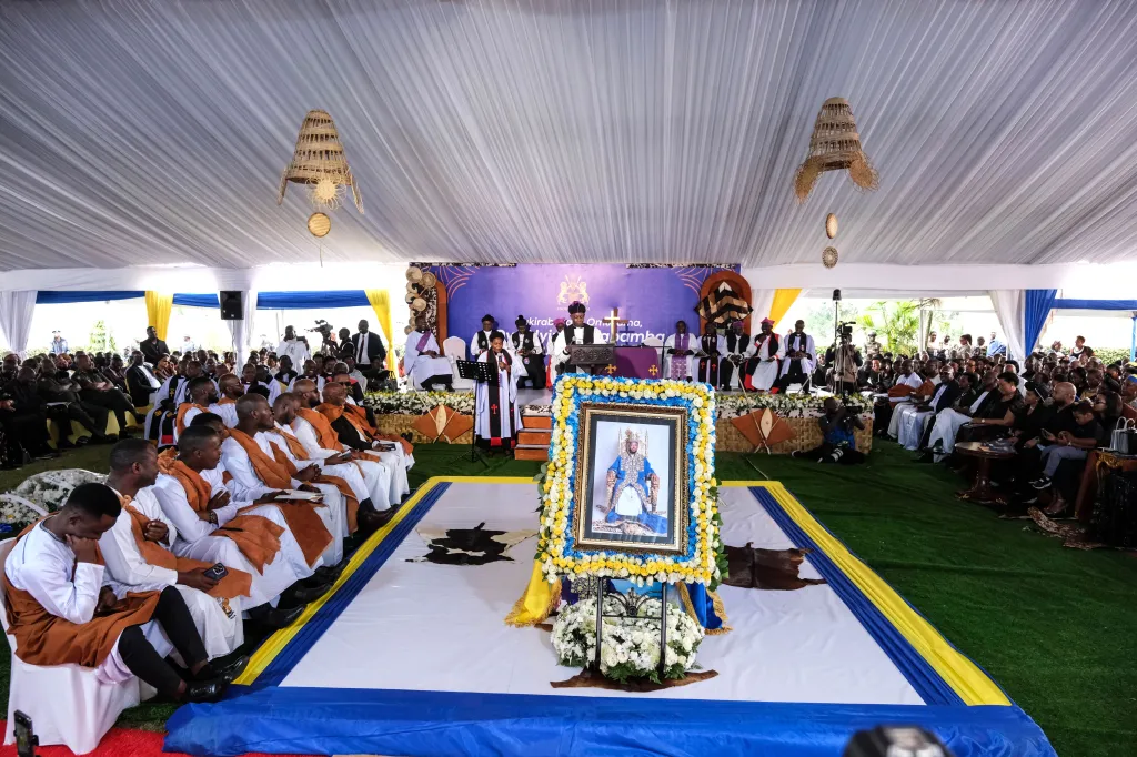 Archbishop Stephen Kazimba Mugalu of the Church of Uganda leads a requiem mass for the late King Oyo Nyimba Kabamba Iguru Rukidi IV of Tooro, with his portrait displayed in front.
