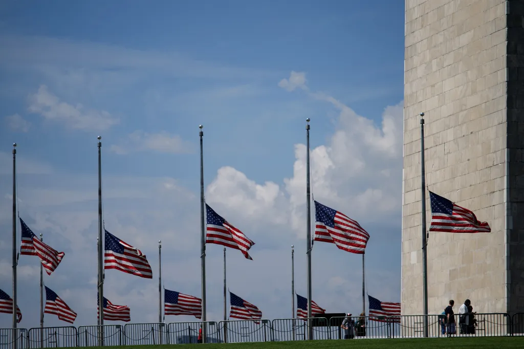 US flags at half-staff near the Washington Monument.
