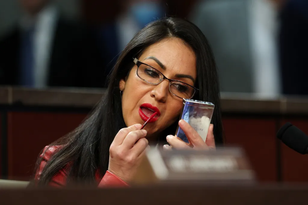 U.S. Rep. Lauren Boebert applies makeup during a House Oversight and Government Reform Committee hearing.