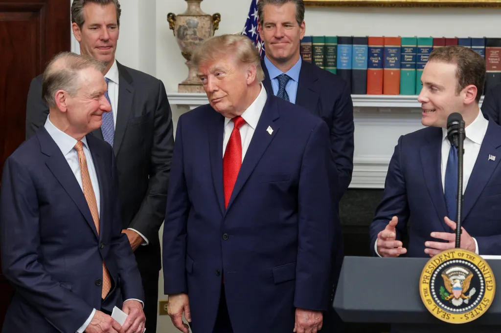 President Trump, Paul Atkins, and Michael Selig at a cryptocurrency and technology summit in the White House.