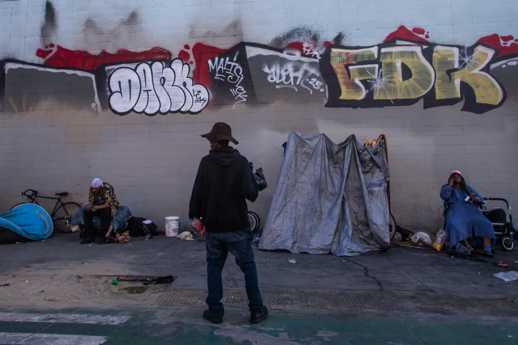 People experiencing homelessness in tents and on the street in the Skid Row area of downtown Los Angeles.