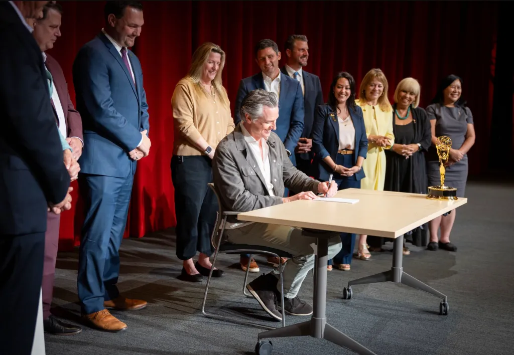 Governor Gavin Newsom signing Assembly Bill 2319 at the Television Academy in Hollywood.
