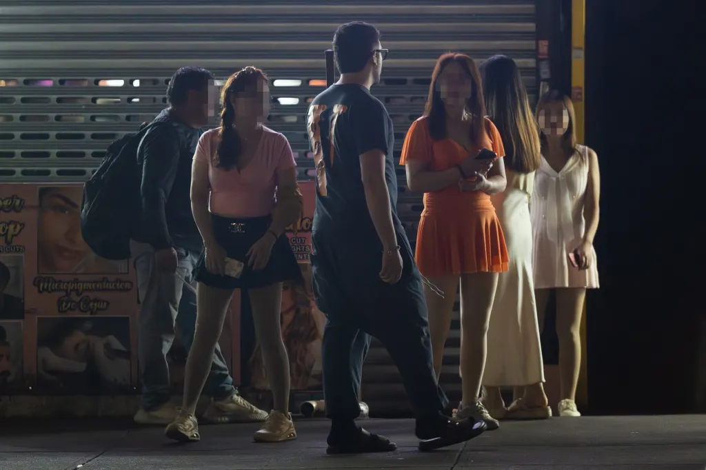Possible sex workers are seen on Roosevelt Avenue in Queens, New York, on Wednesday, Sept. 16, 2026.