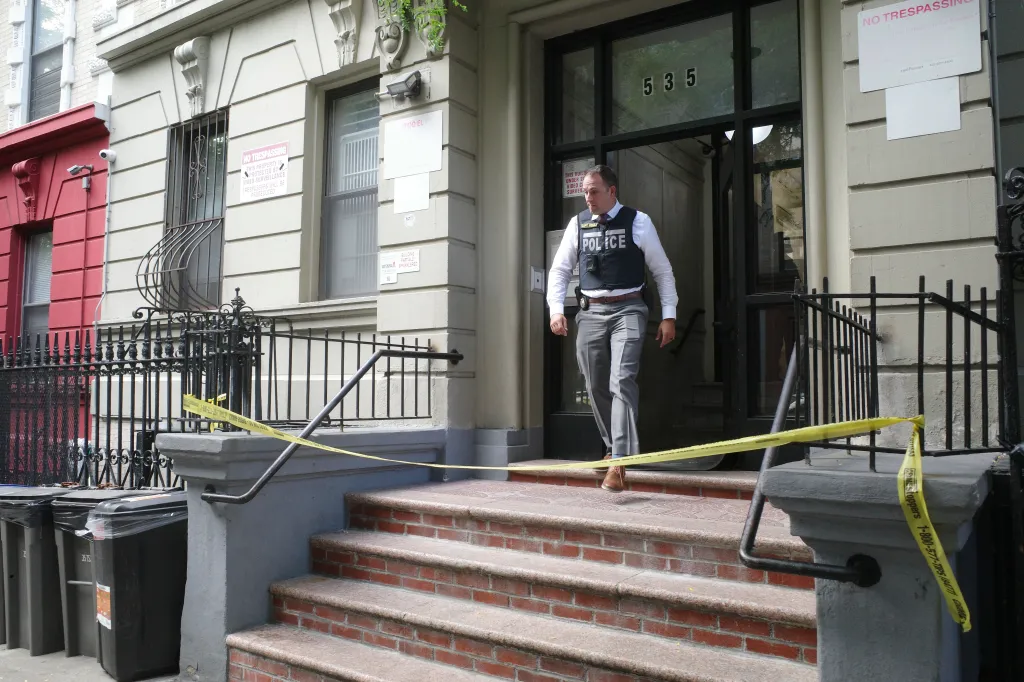 A 27-year-old woman was discovered beaten to death Sunday inside a Manhattan apartment, where a young child had been left alone with her battered body for an unknown length of time, according to police sources.