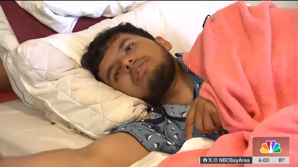 Zubayir Kazi resting in bed after climbing a mountain.