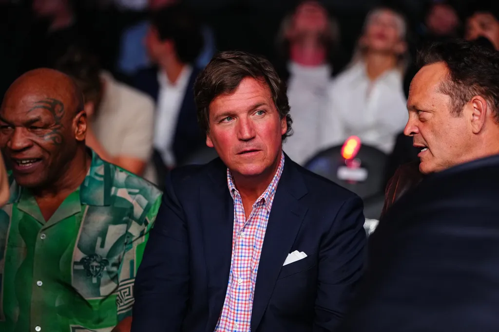 Tucker Carlson, Mike Tyson, and Vince Vaughn attend UFC 329 at T-Mobile Arena.