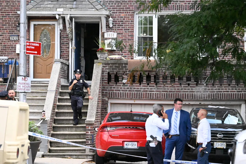 NYPD officers investigating an accidental shooting at 3930 Bailey Avenue in the Bronx.