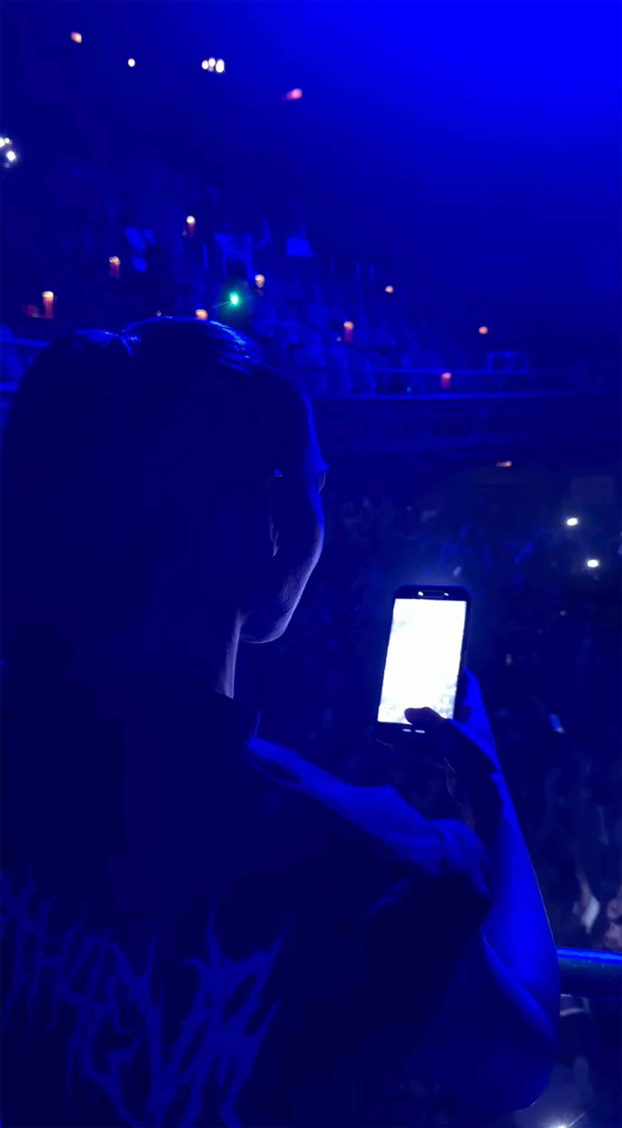 Kim Kardashian records her daughter North's first solo concert on a smartphone.