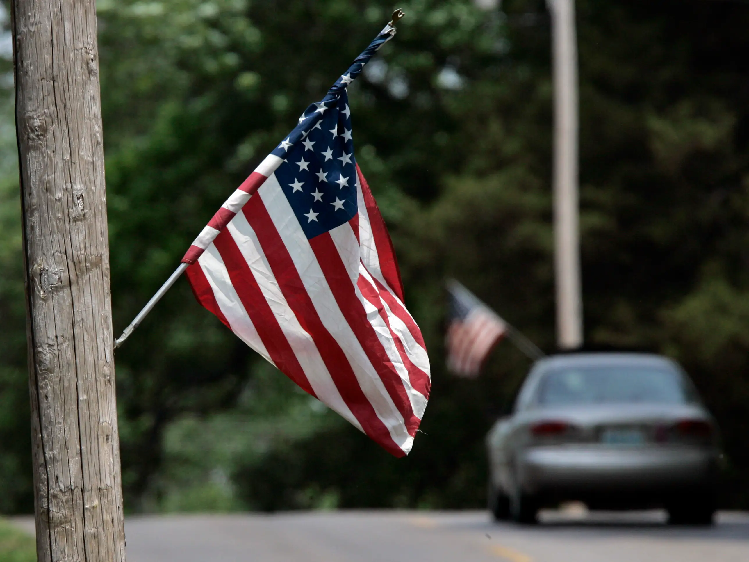 american flag on street pole USA america