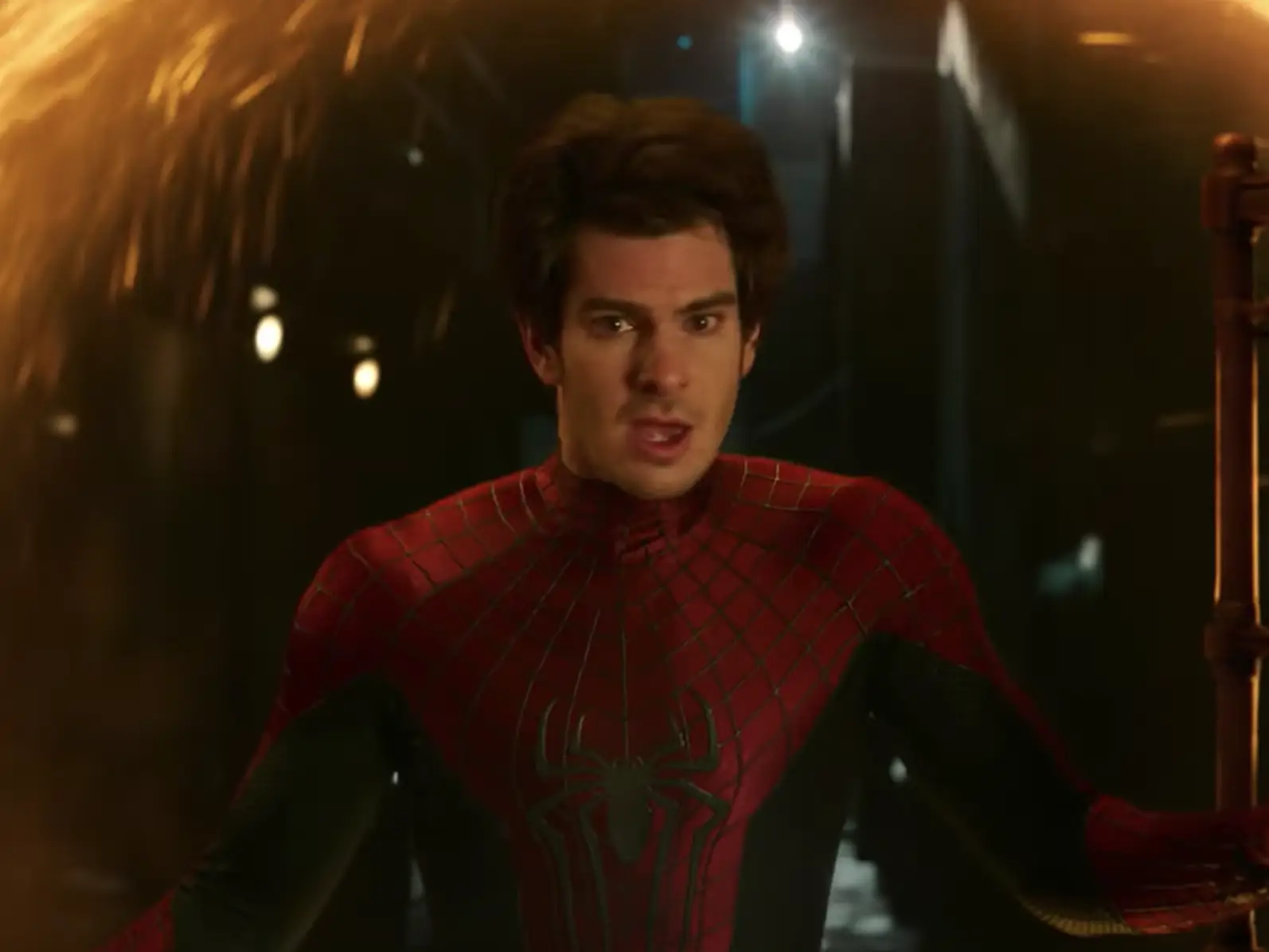Andrew Garfield's version of Spider-Man emerging from a portal in 
