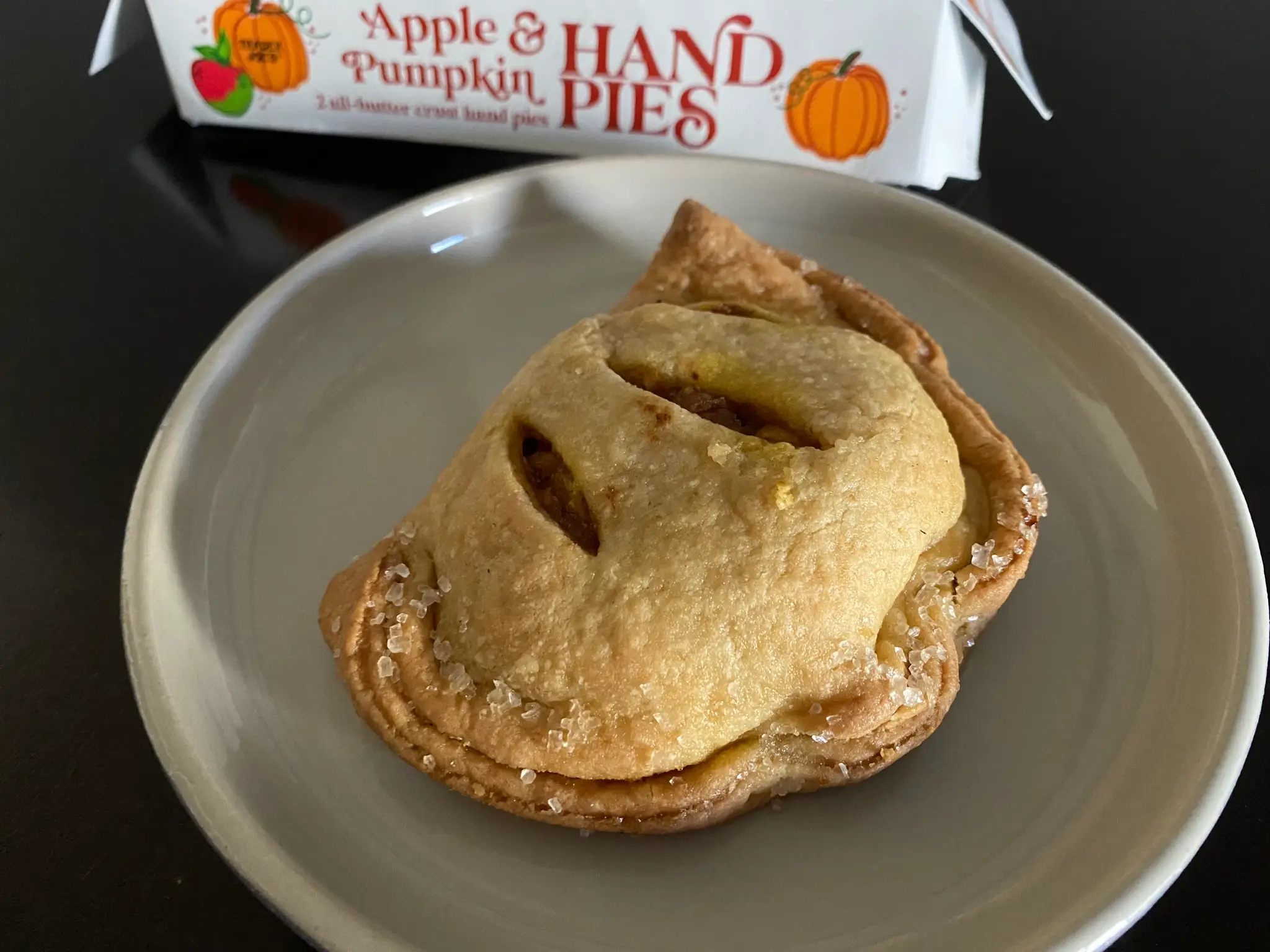 Pumpkin-shaped hand pie on plate