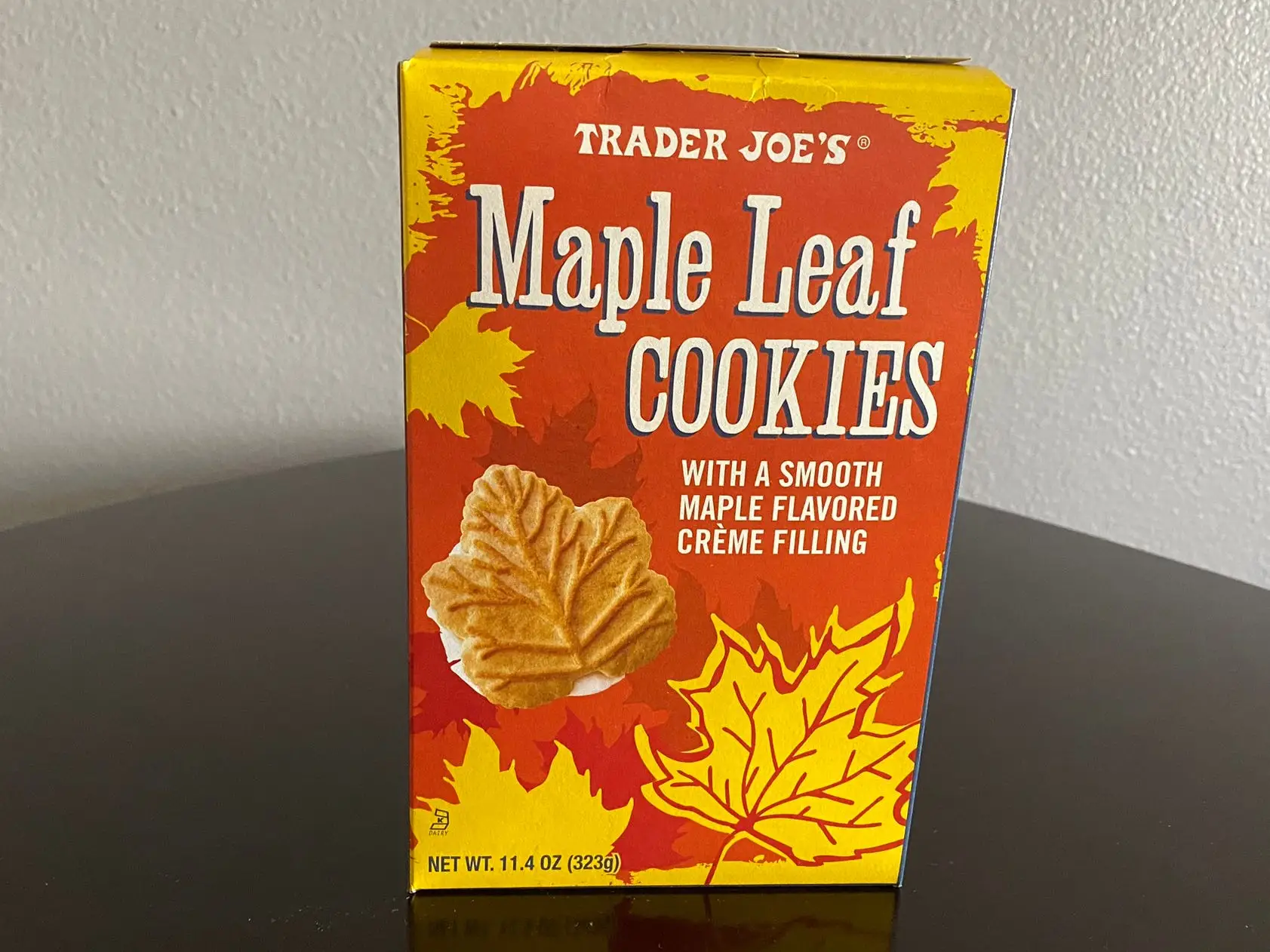 Trader Joe's maple leaf cookies box on black table