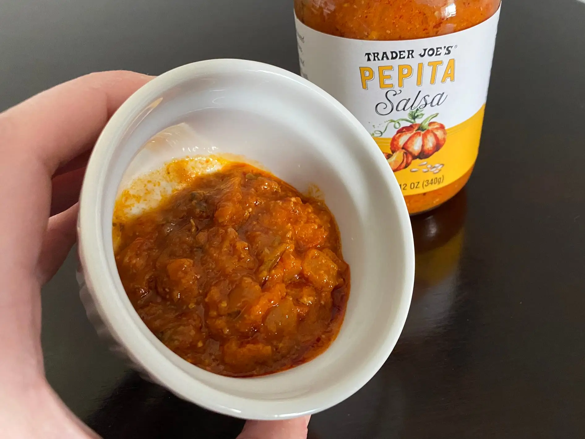 Orange salsa in white ramekin
