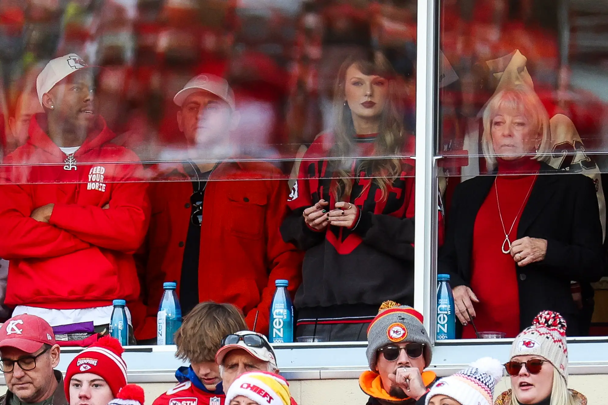 Taylor Swift in a stand at a football game.