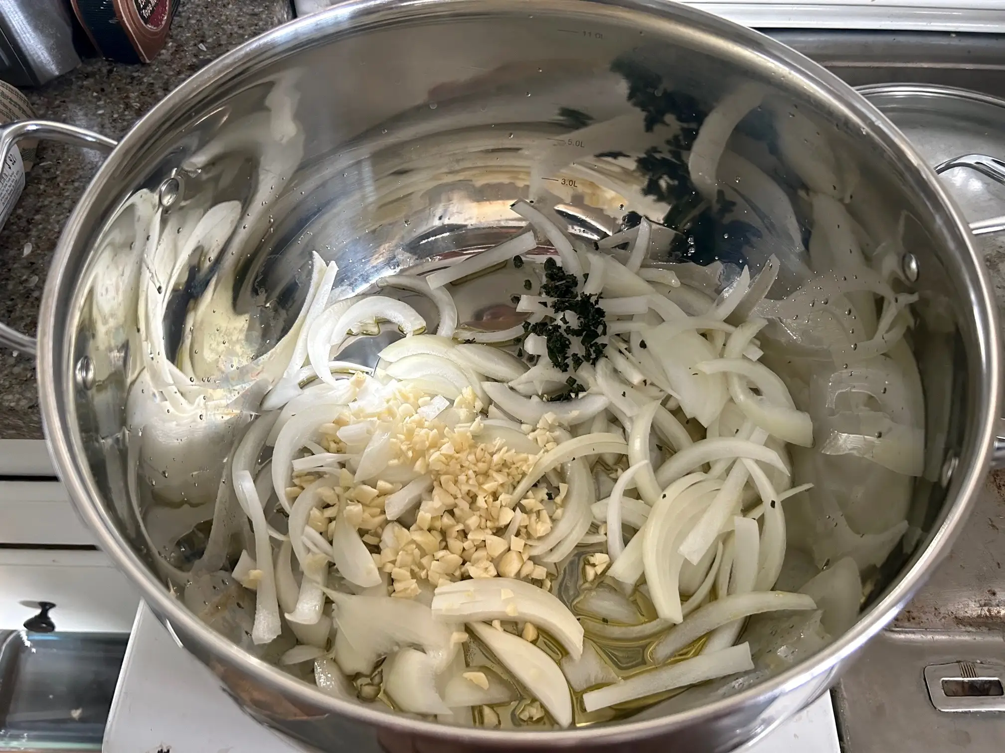 Cooking veggies and herbs for Pioneer Woman's Lasagna Soup