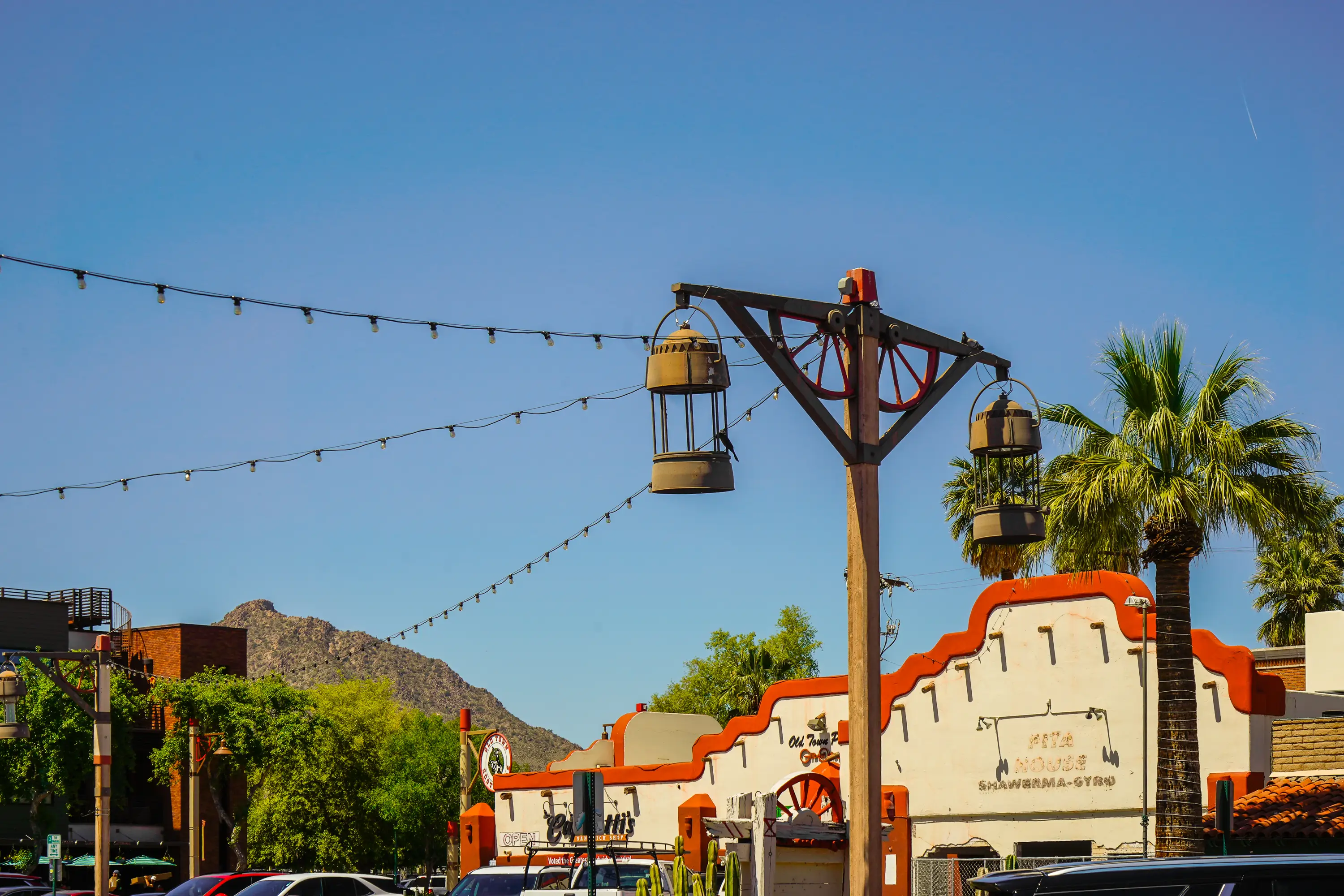 Southwestern architecture in front of a mountain with blue skies