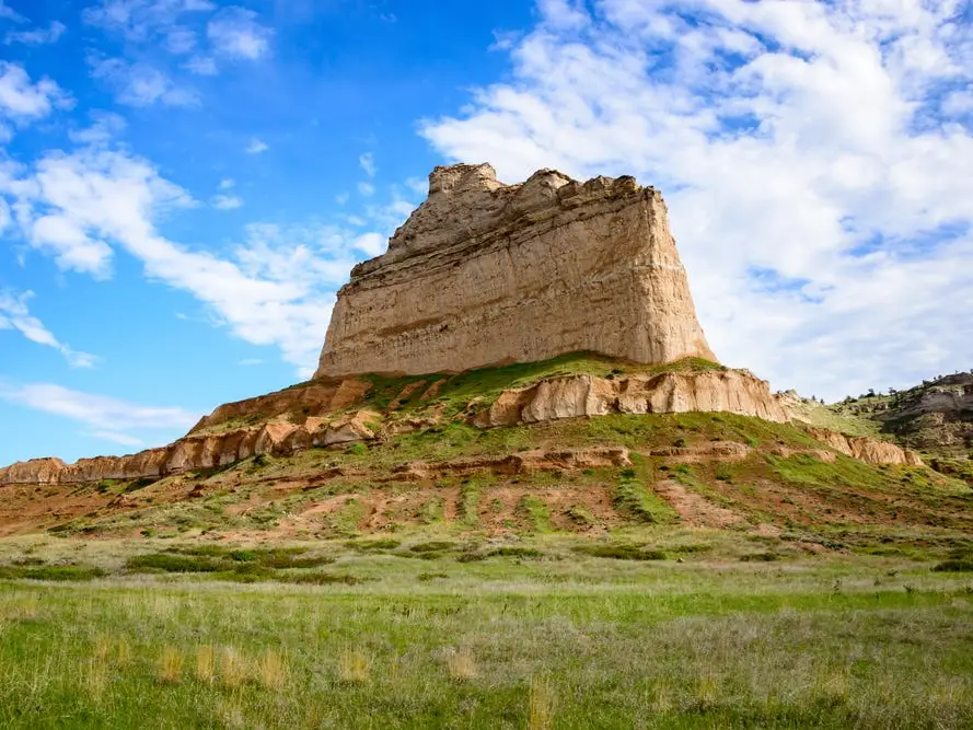 A large rock formation on a hill in Scotts Bluff National Monument.