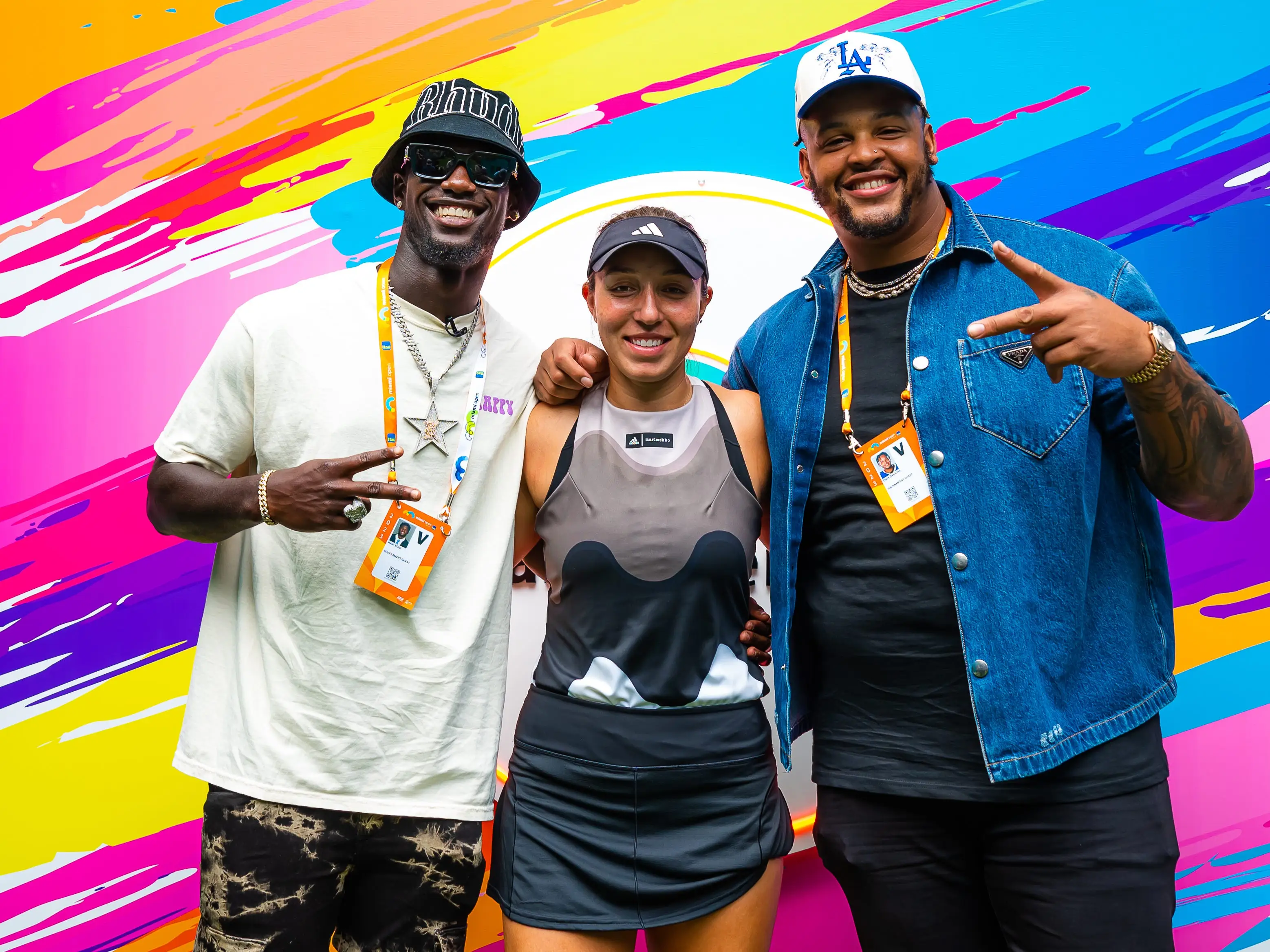 Jessica Pegula, center, smiles with Buffalo Bills players Kaiir Elam and Dion Dawkins.