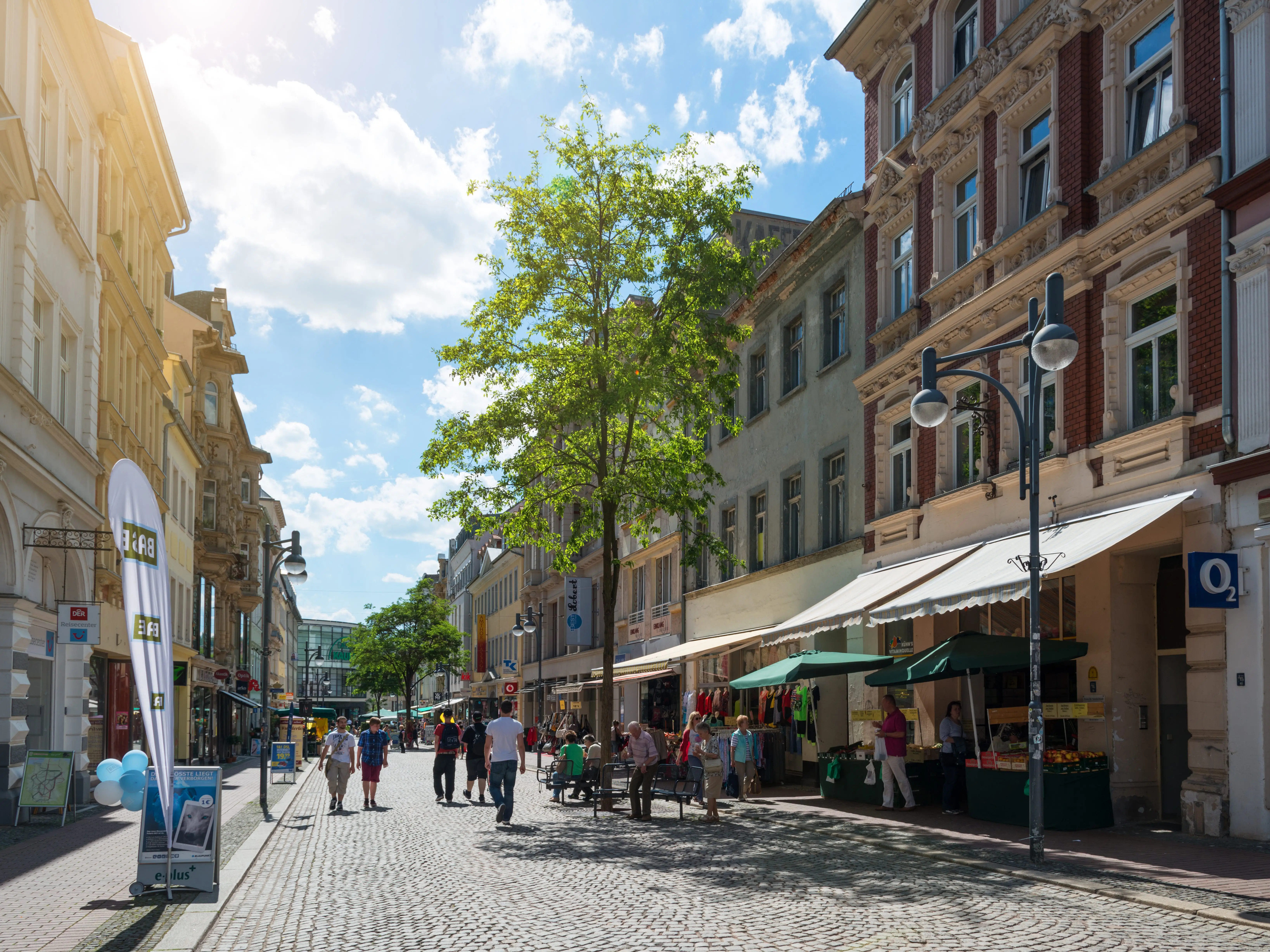A shopping street called Sorge in Gera, a city in the Thuringia state, showcasing shops and houses.