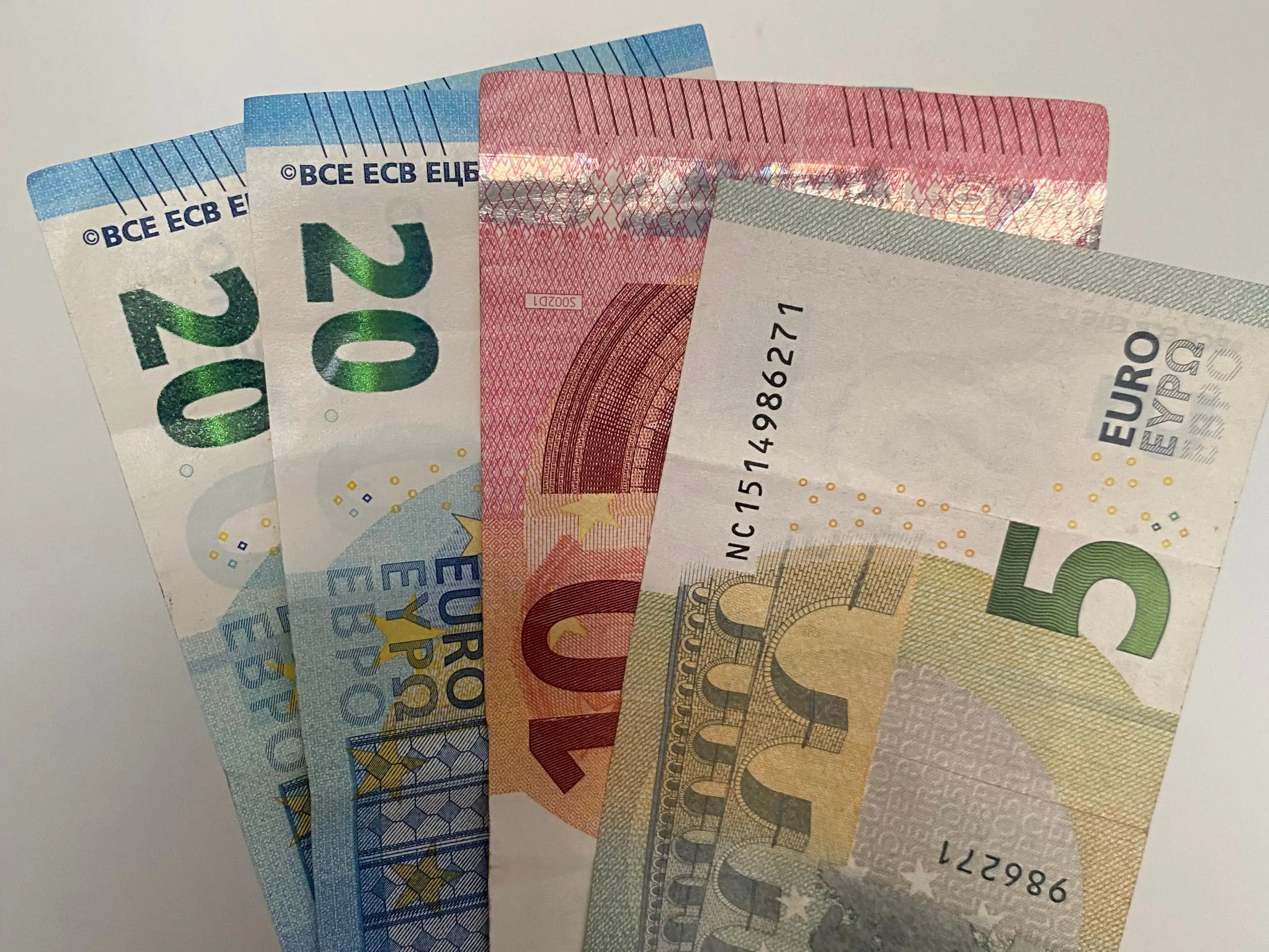 Four euro banknotes.