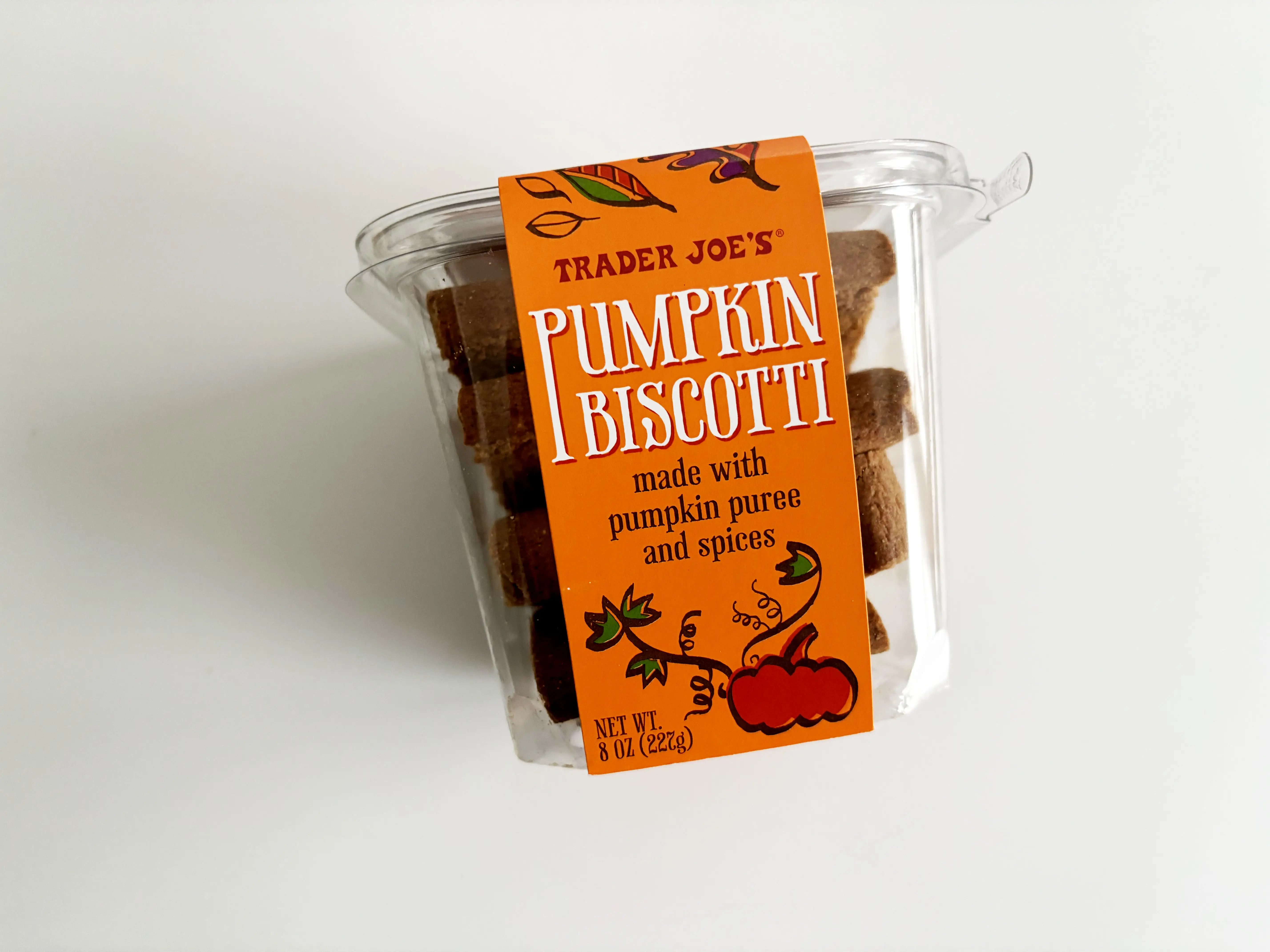 A plastic box of pumpkin biscotti from Trader Joe's.