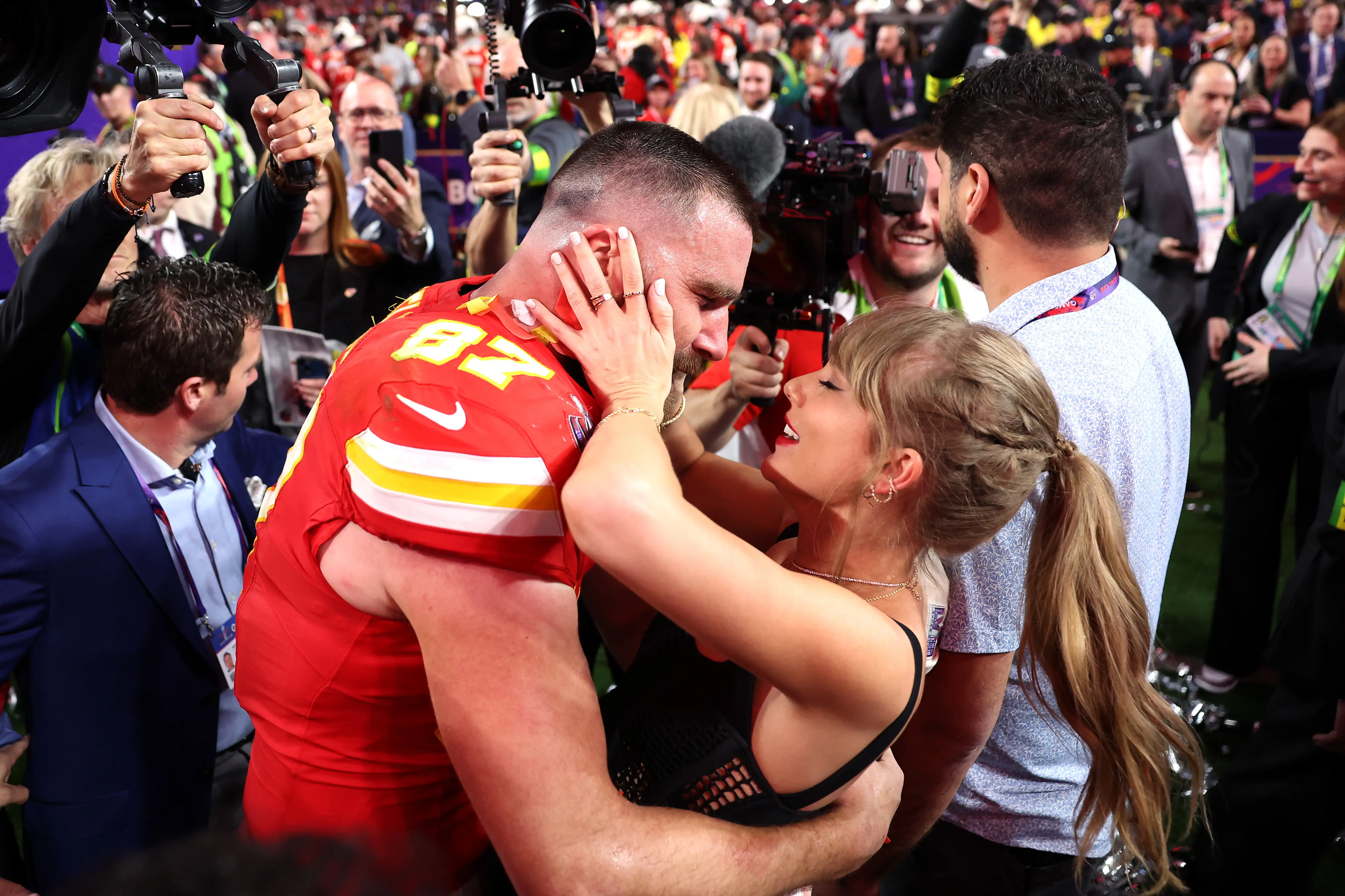 Travis Kelce #87 of the Kansas City Chiefs celebrates with Taylor Swift after defeating the San Francisco 49ers 25-22 in overtime during Super Bowl LVIII at Allegiant Stadium on February 11, 2024