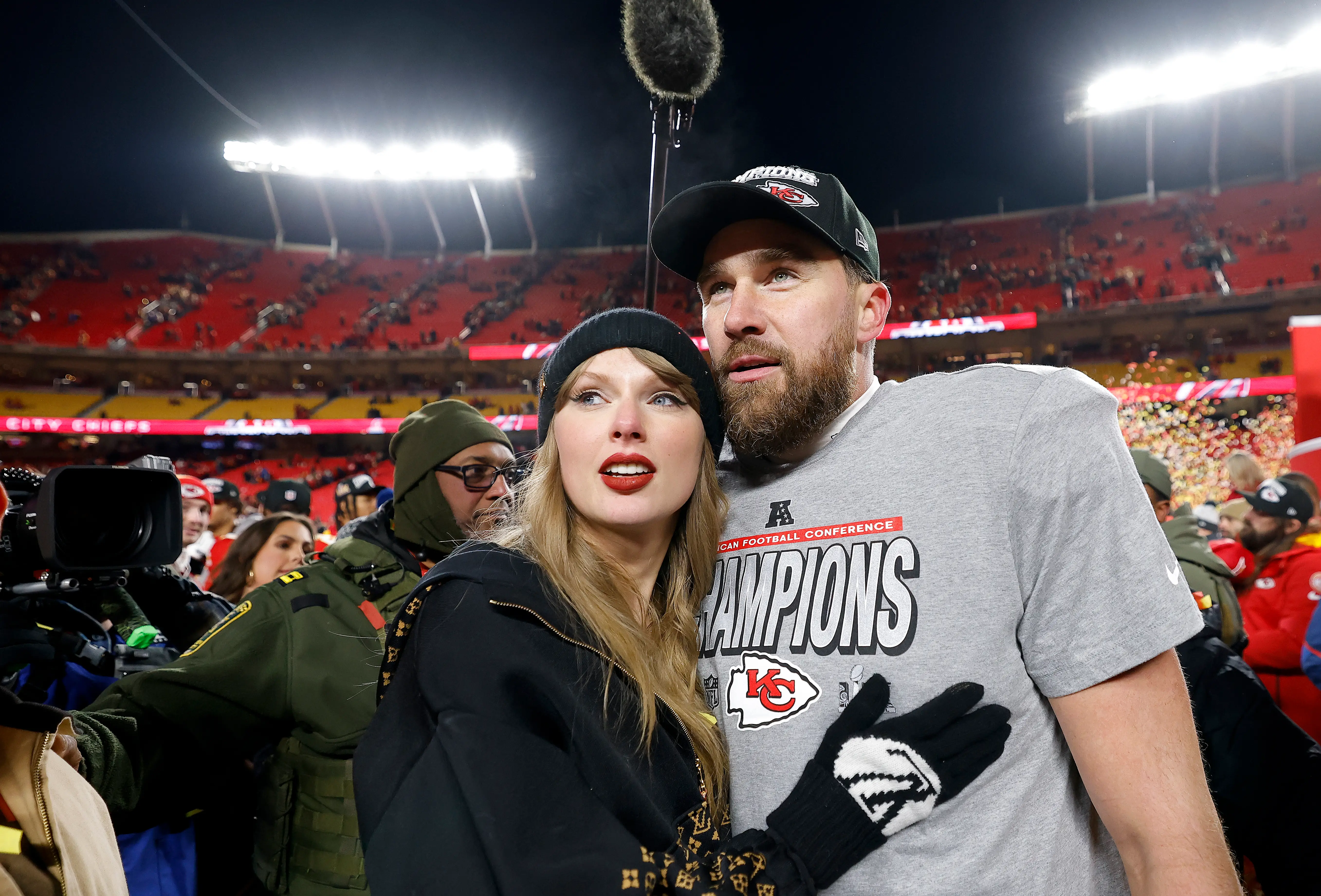 Taylor Swift and Travis Kelce celebrate the Kansas City Chiefs becoming 2025 AFC champions.
