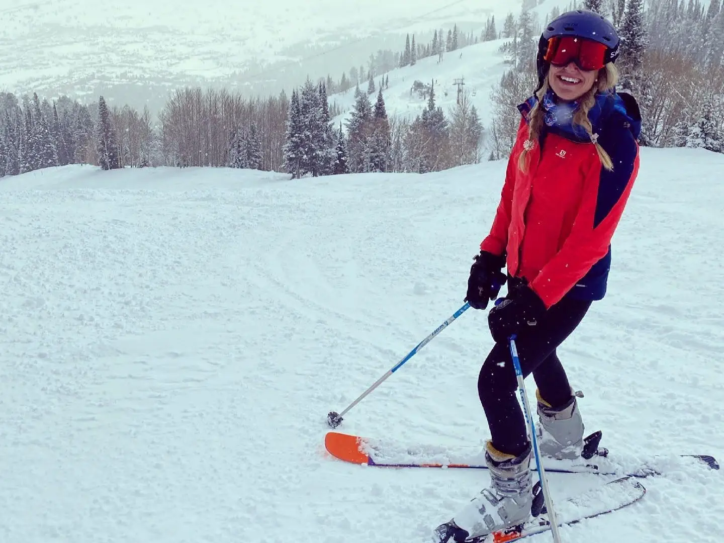 Author Katherine Parker-Magyar smiling in ski gear on snowy slopes in Jackson Hole
