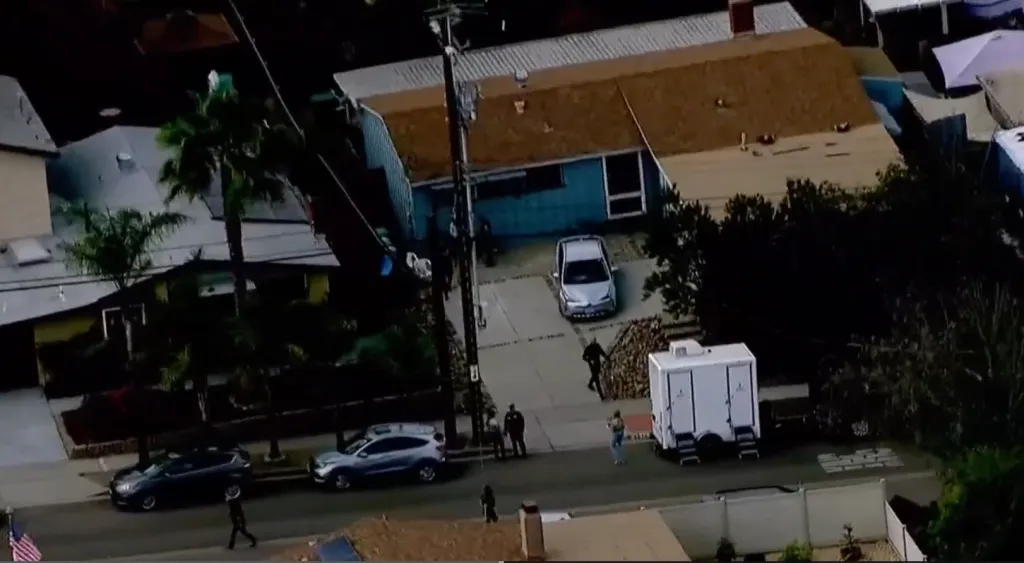 Aerial view of police investigating a possible murder-suicide outside a home on Boulder Lake Avenue in San Diego.