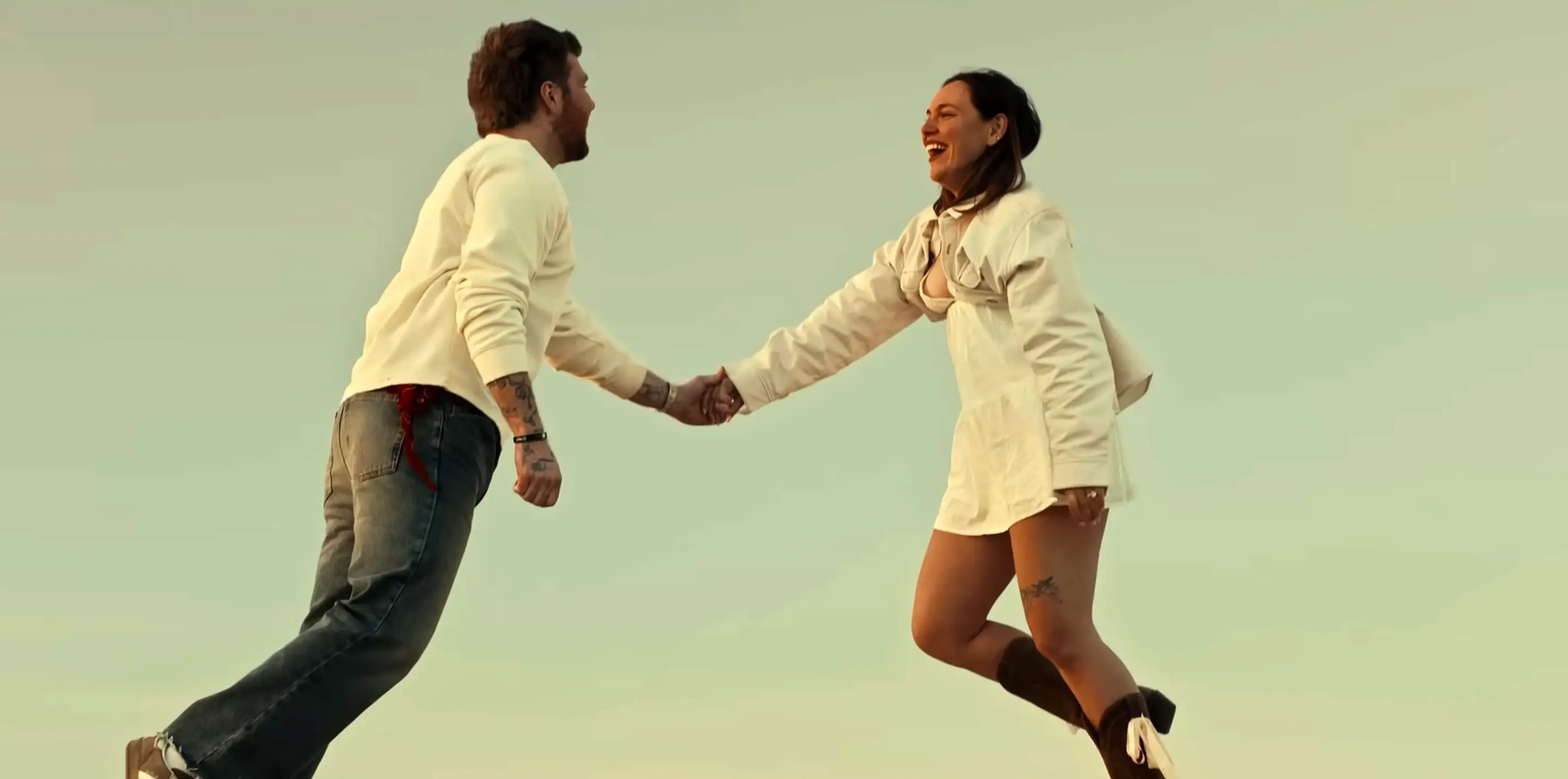 Alex Warren and his wife, Kouvr Annon, in the music video for