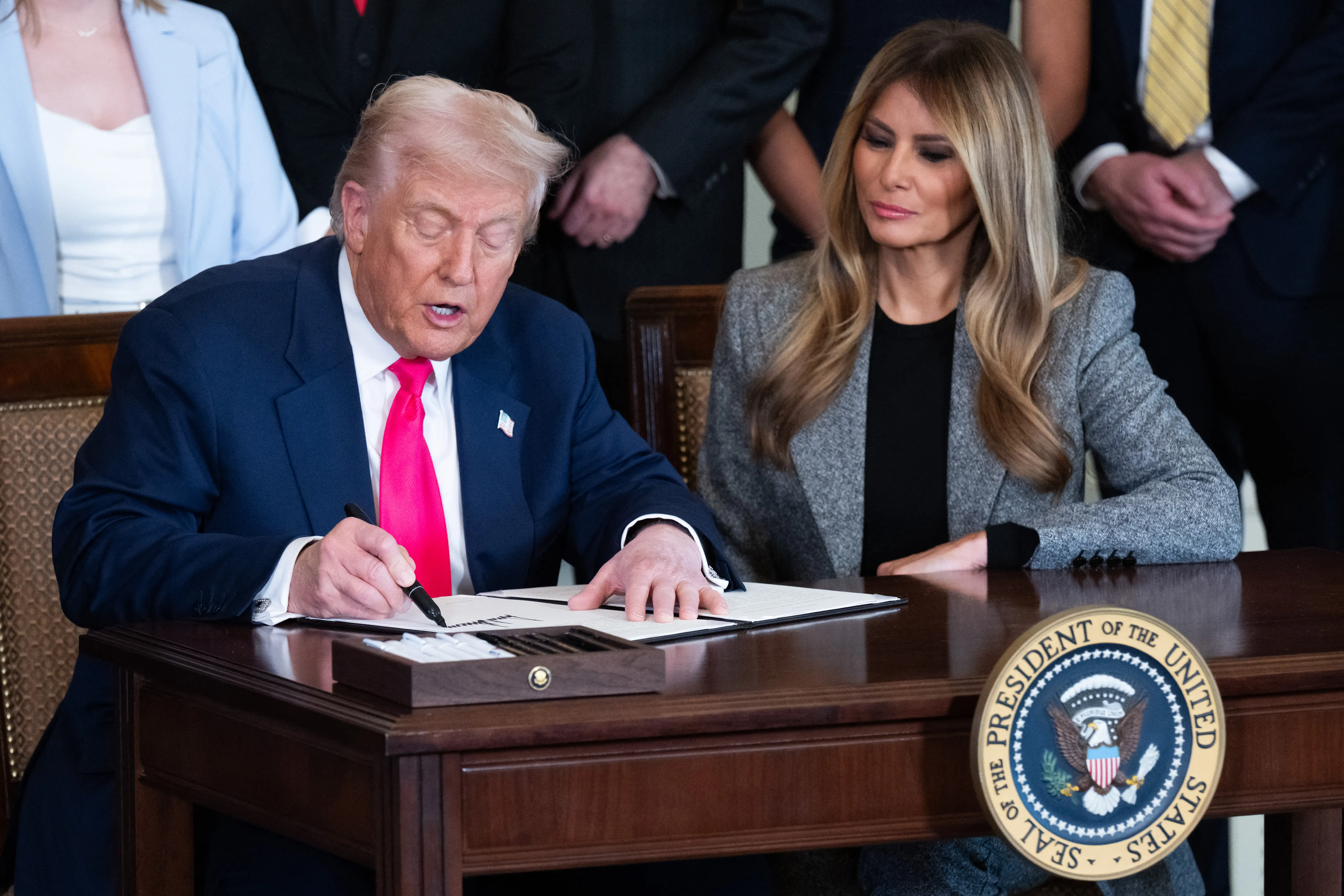 President Trump and Melania Trump sign an executive order to strengthen the foster care system, as part of the first lady's 