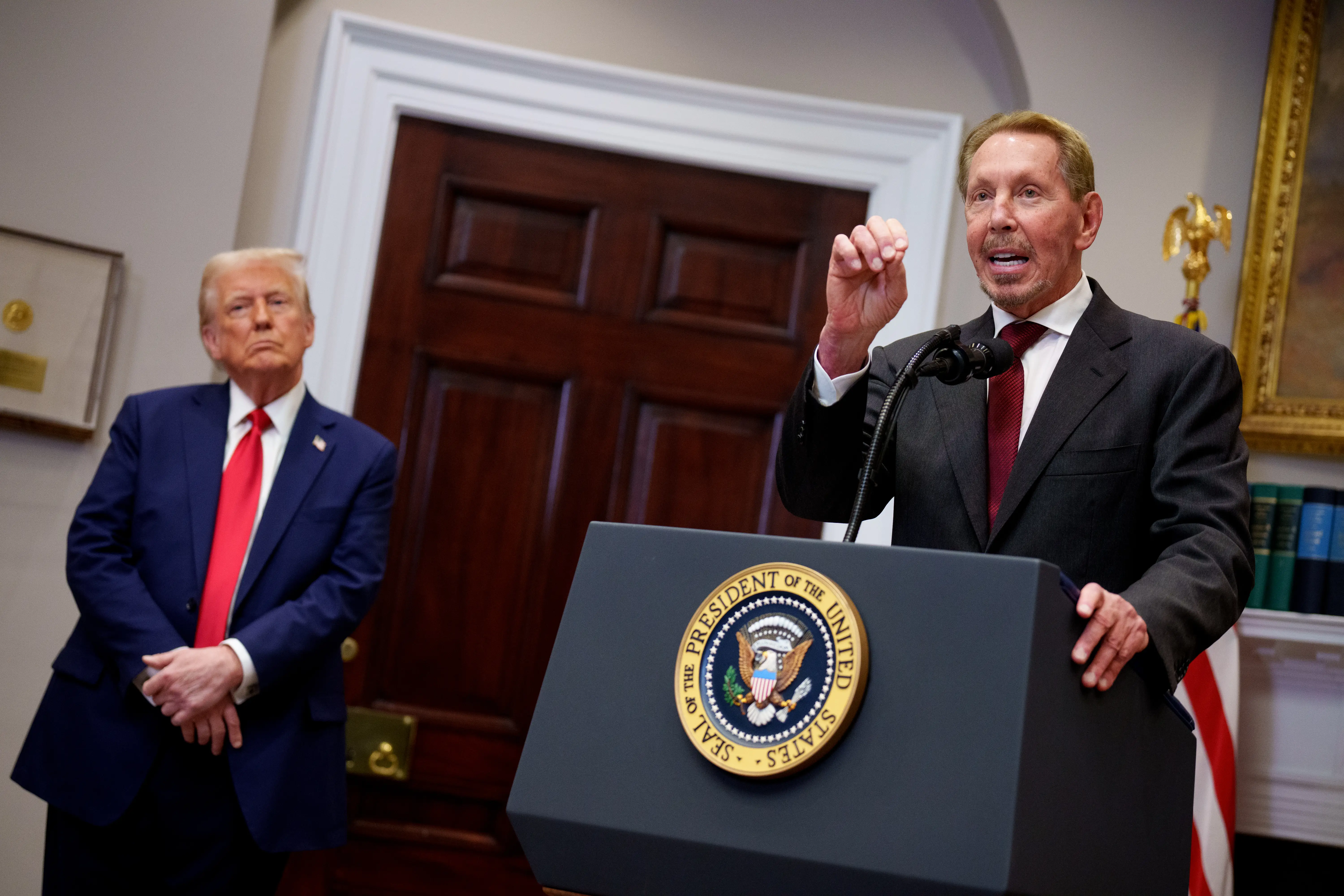 Oracle co-founder Larry Ellison speaks at the White House as Donald Trump looks on, January 2025