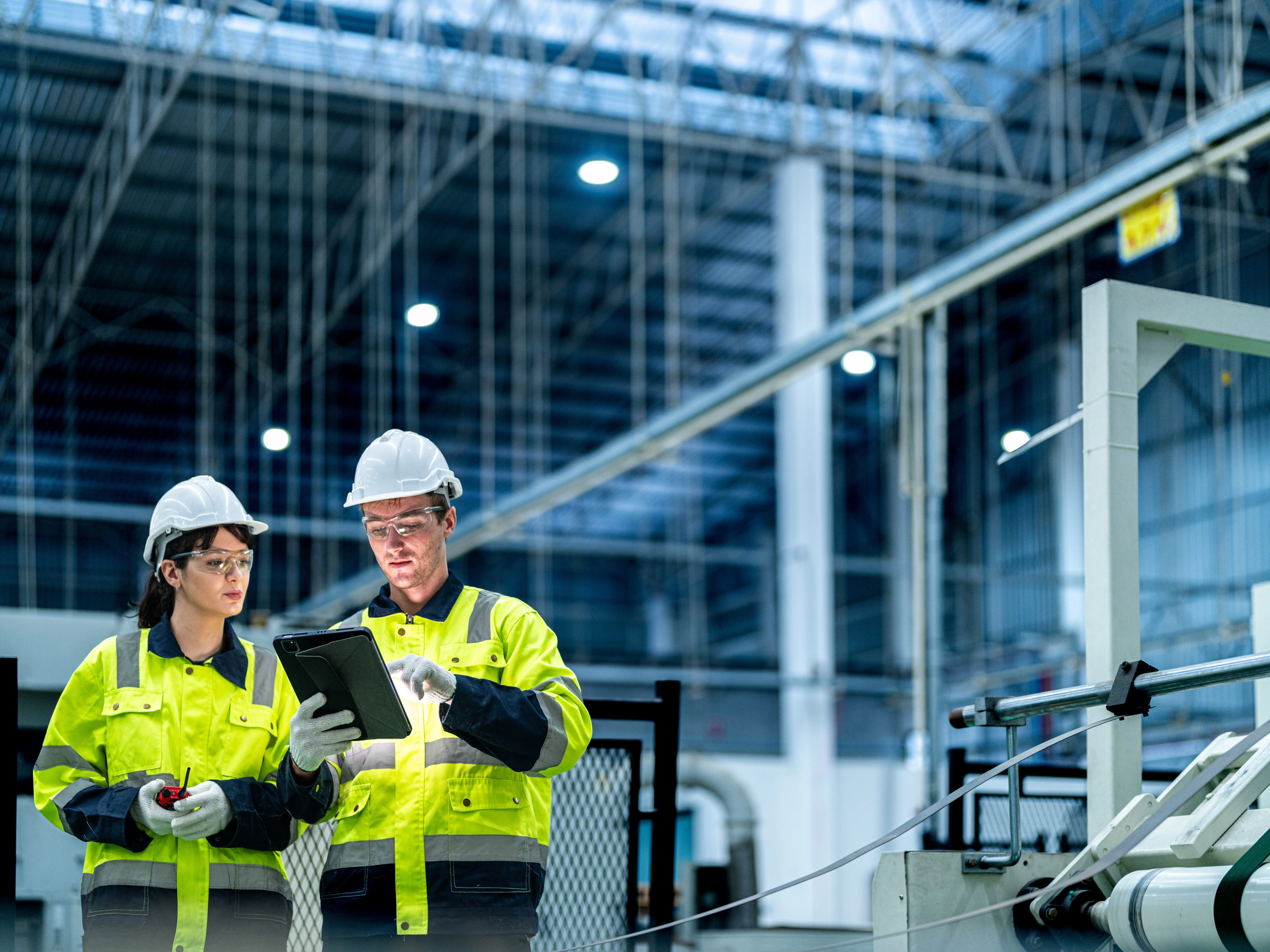 Engineers looking at a tablet