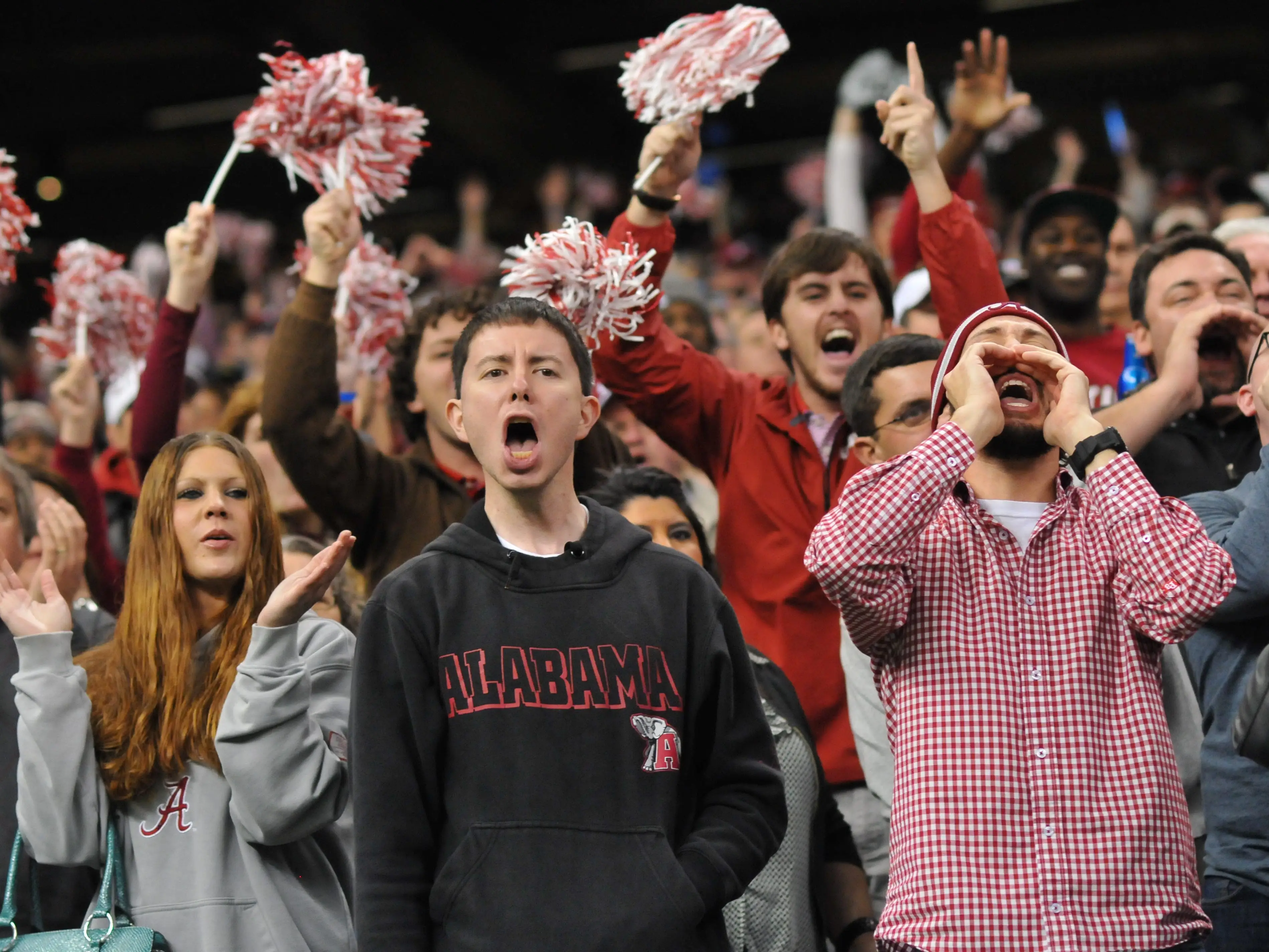Fans of the Alabama Crimson Tide cheer during game action against the Oklahoma Sooners in the BCS Sugar Bowl on January 2, 2014