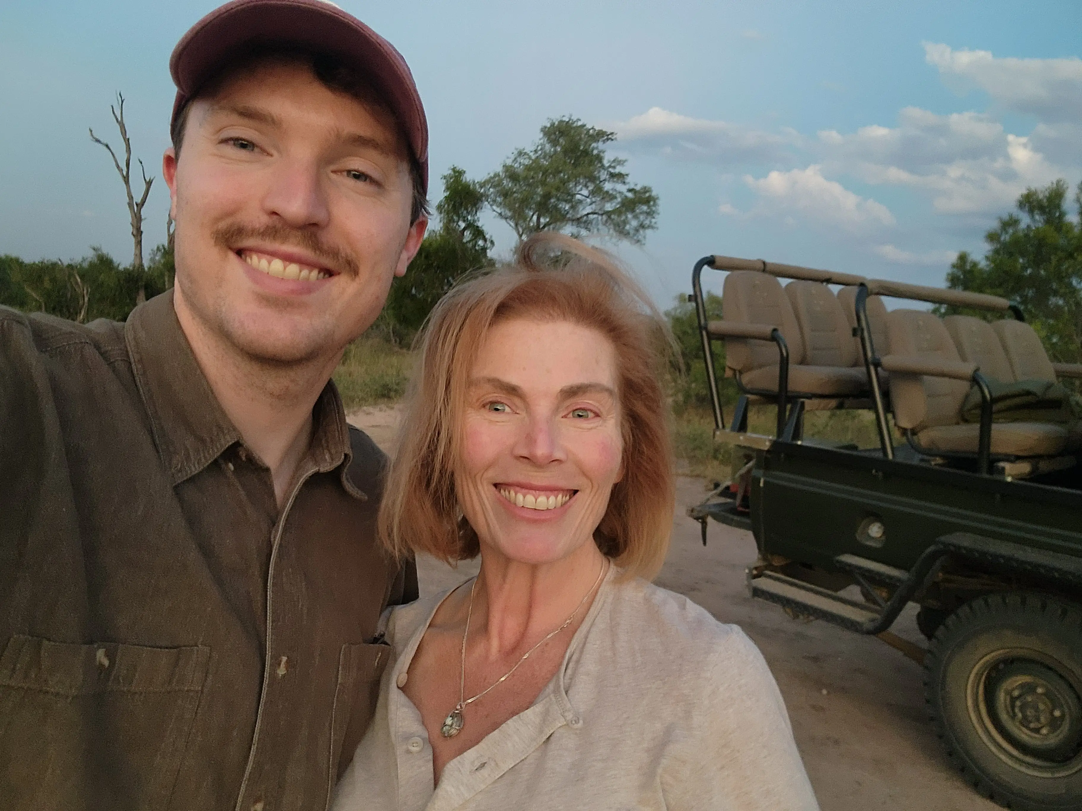 The author poses with one of her sons while on safari.