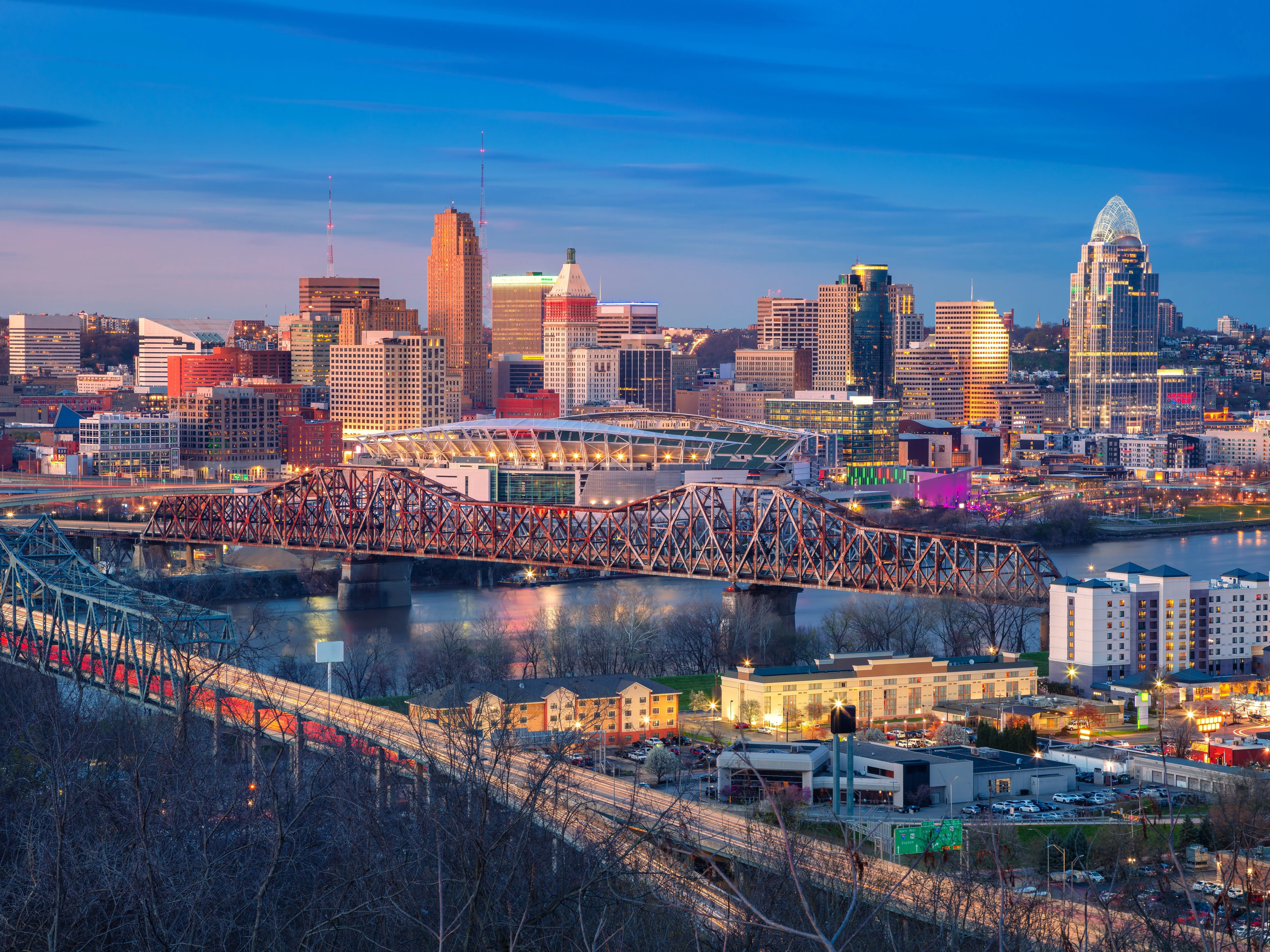 Cincinnati, Ohio, USA. Aerial cityscape image of Cincinnati, Ohio, USA downtown skyline with bridges and Ohio River at spring sunset.