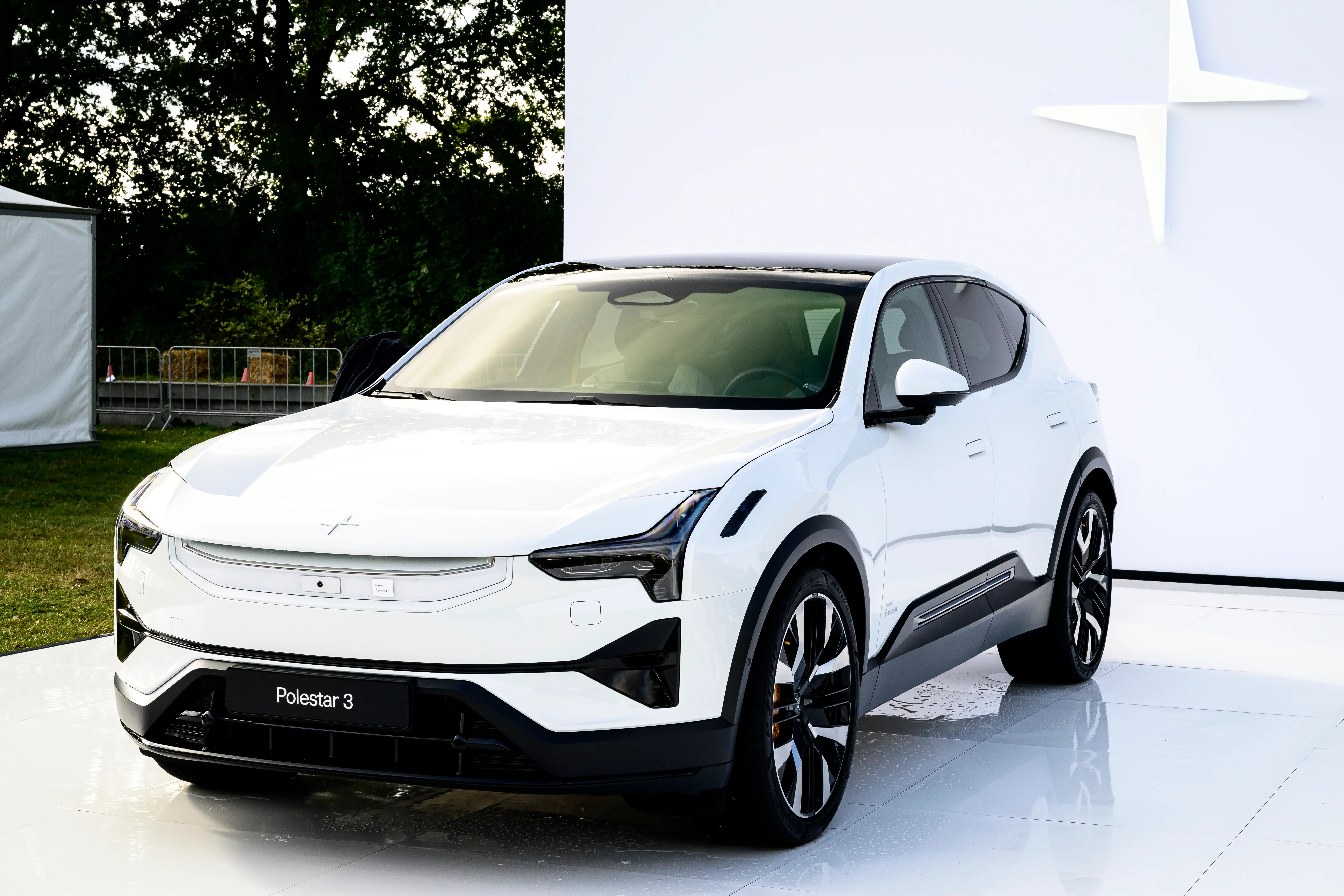 A white Polestar 3 on display during a press event.