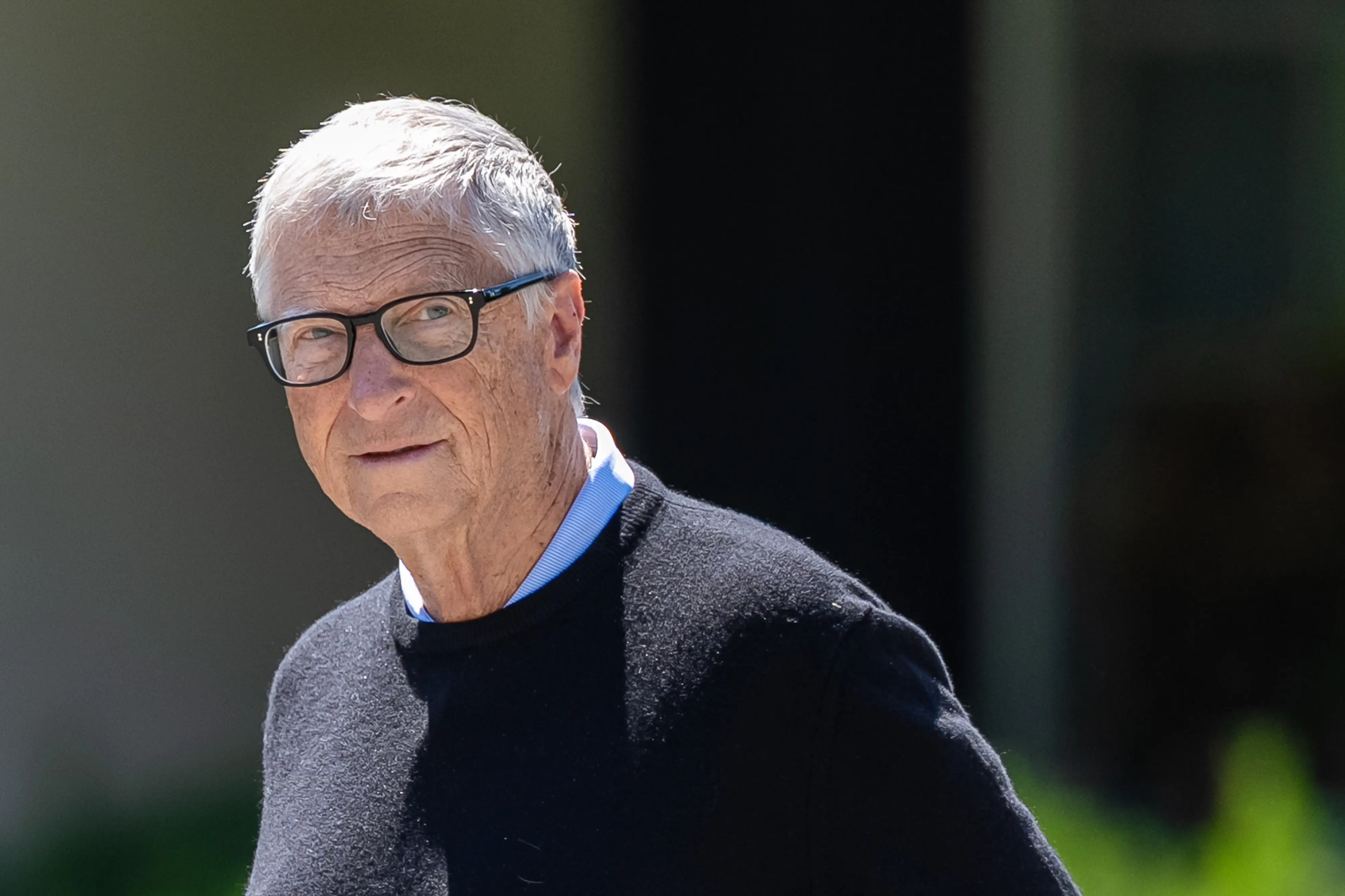 Bill Gates walks outside during the Allen & Co. Media and Technology Conference in Sun Valley, Idaho.