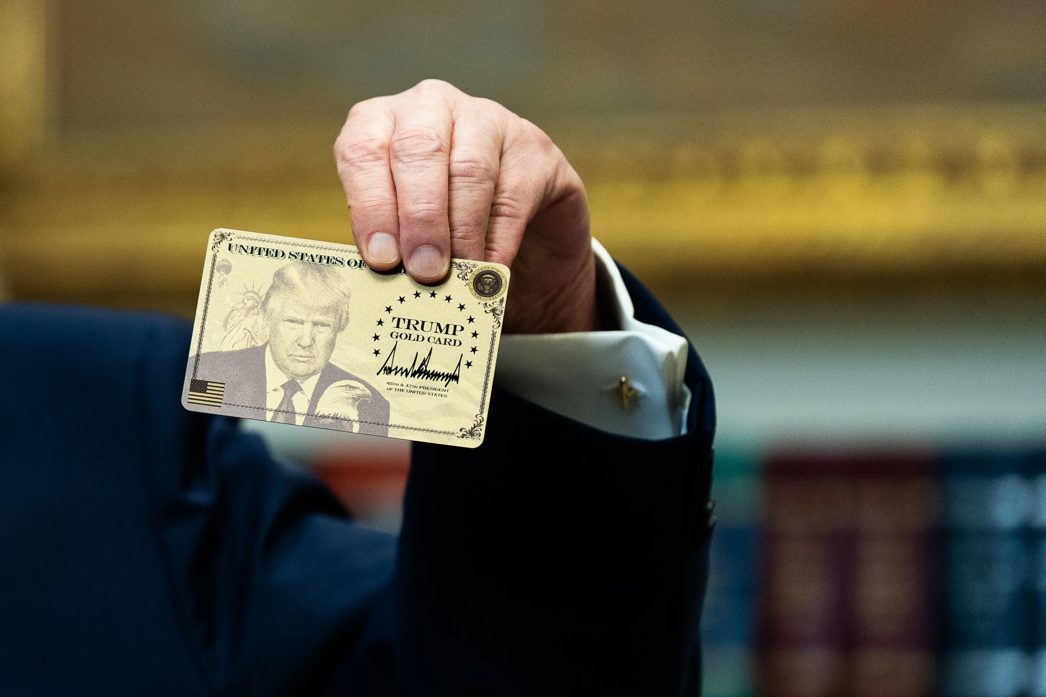 President Donald Trump held a Trump Gold Card in the Roosevelt Room of the White House at an event in December.