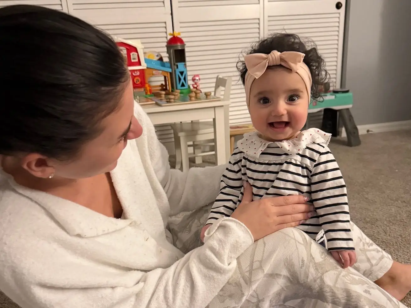 Woman smiling with baby