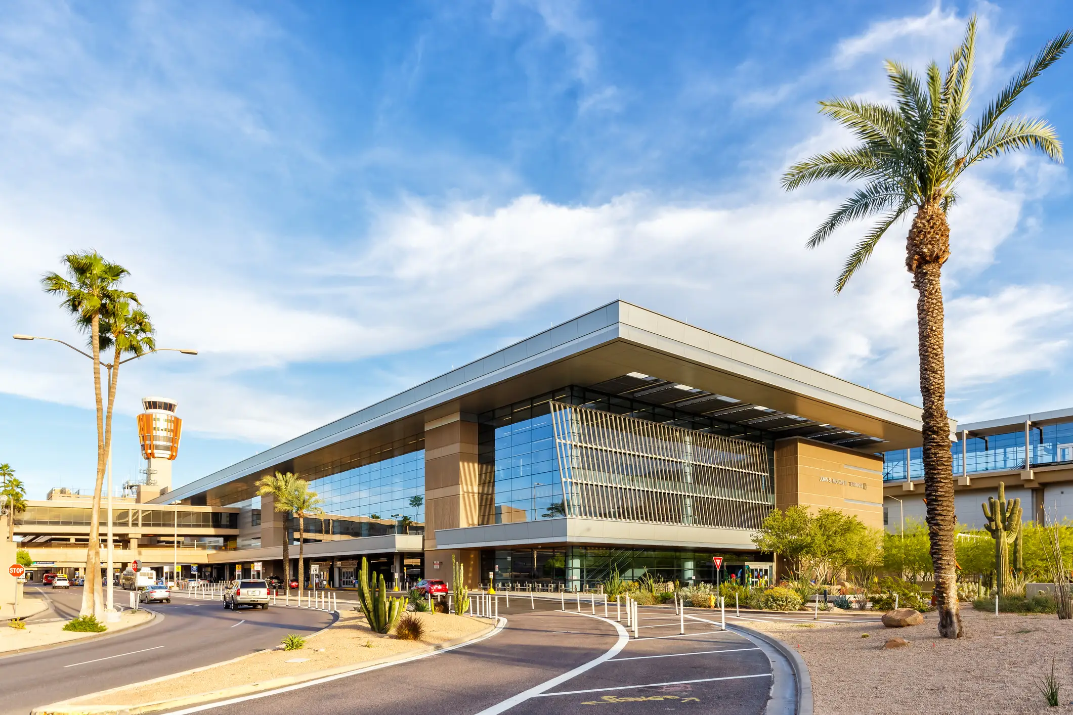 Terminal 3 of Phoenix Sky Harbor airport with palm trees on either side.