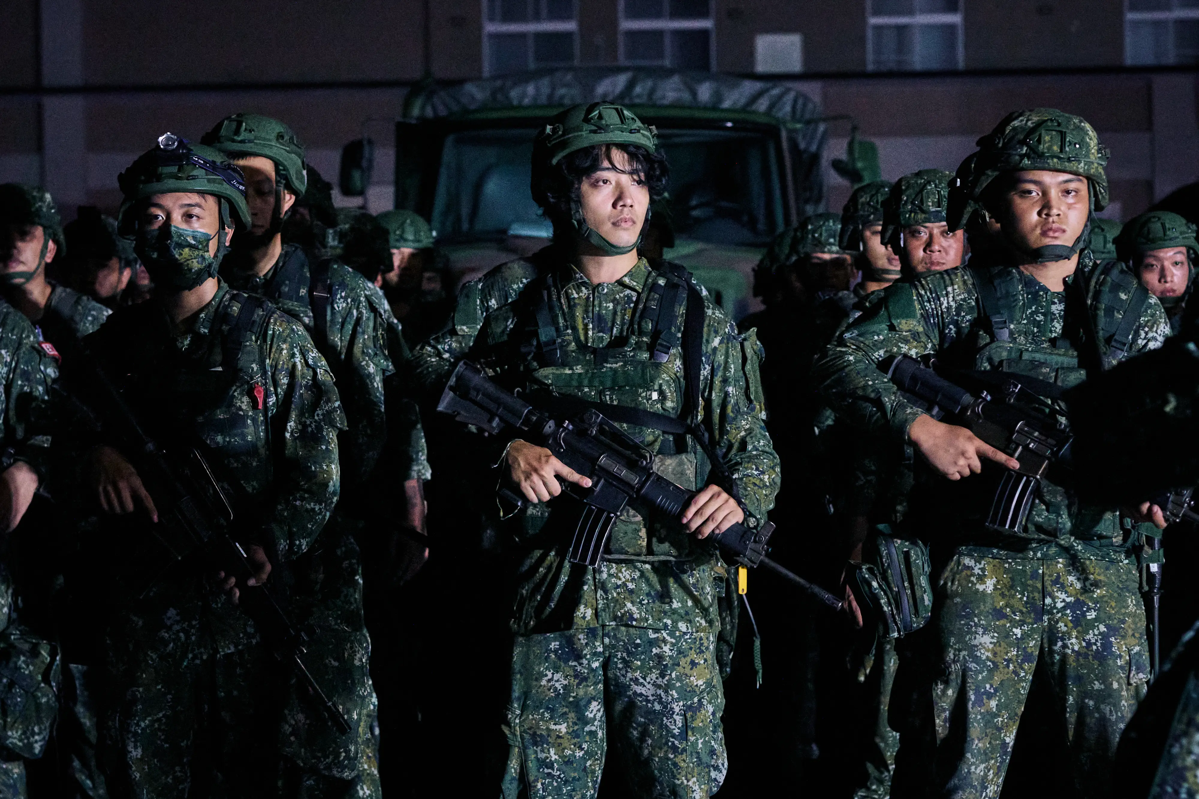 Soldiers line up in preparation for a company move during a military exercise in Hualien.