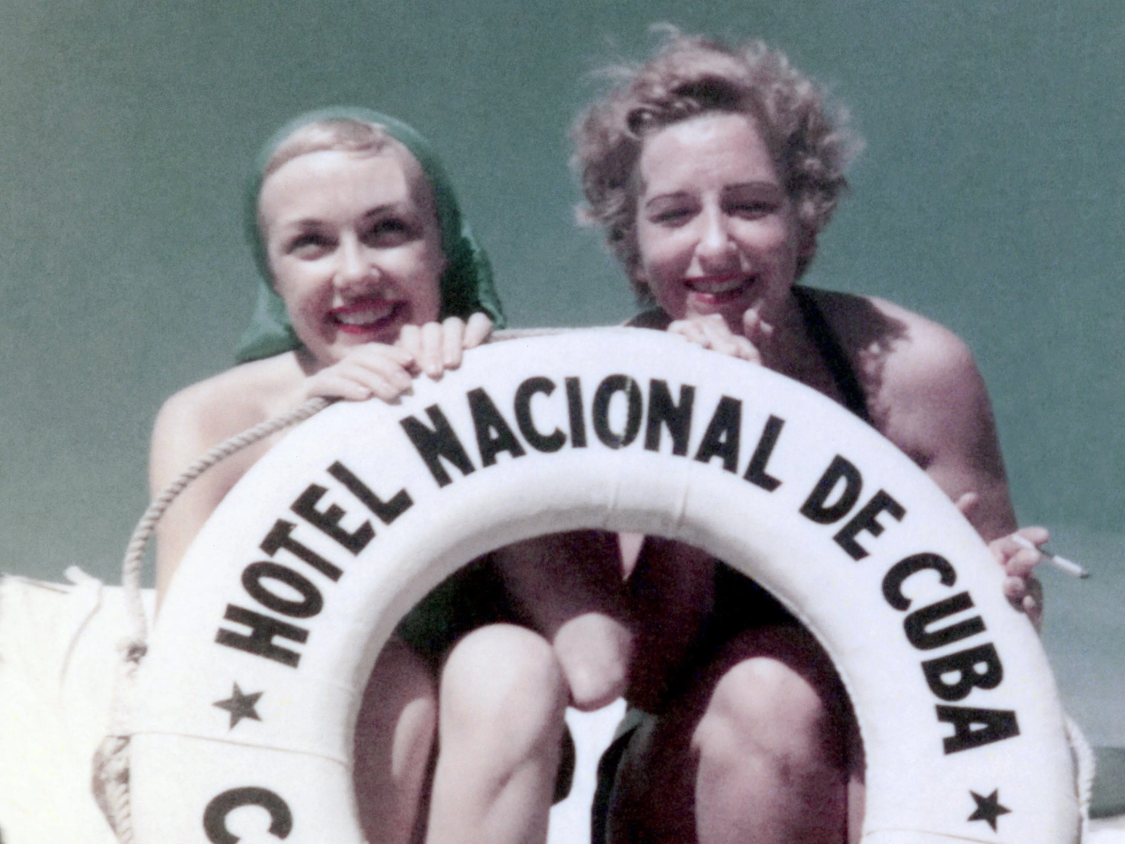 American comedienne, actress, singer and businesswoman, Edie Adams (1927-2008) (left), poses for a portrait with a friend at the Hotel Nacional de Cuba, Sun Club Cabana circa 1950 in Havana, Cuba.