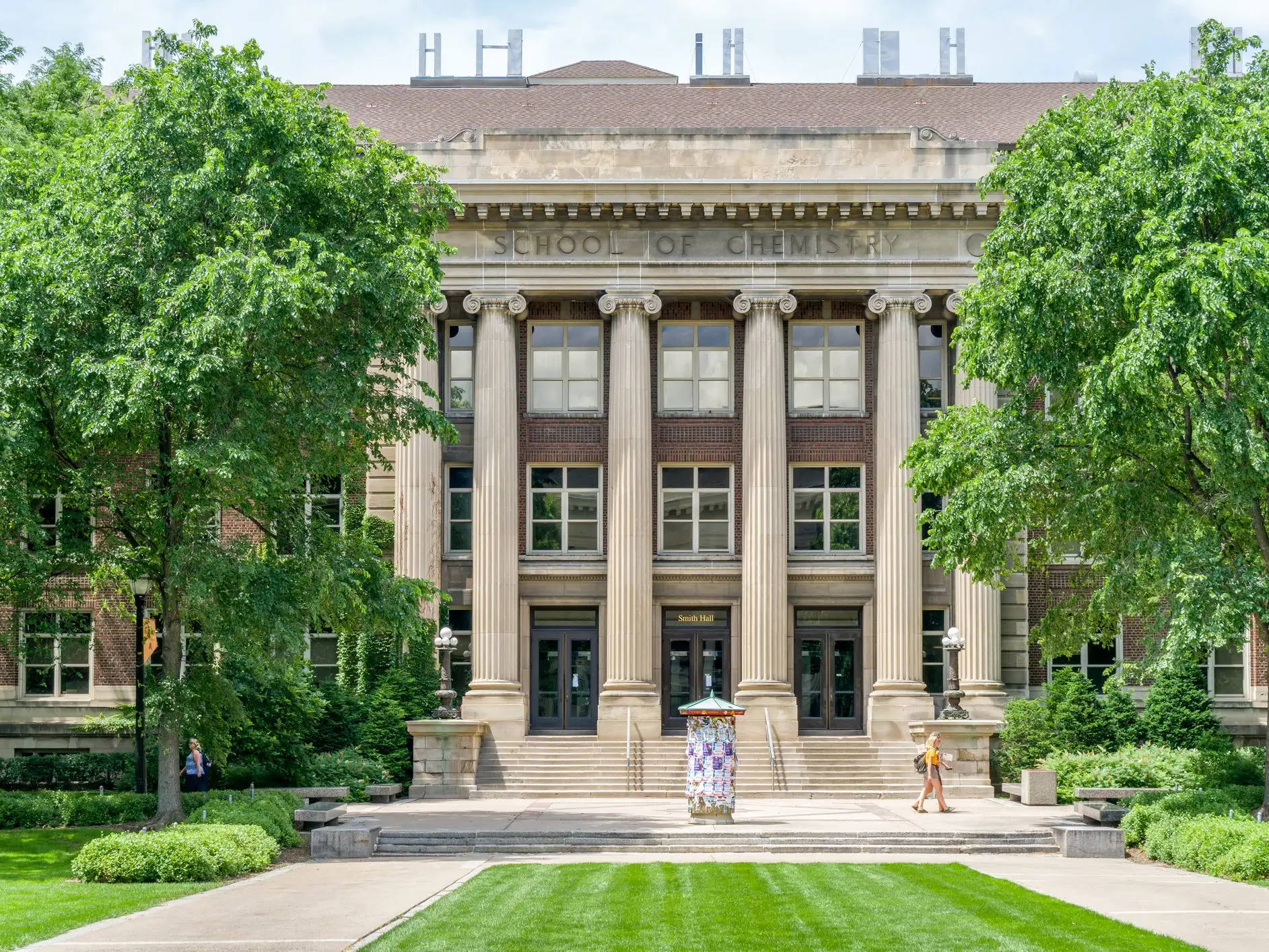 Smith Hall, School of Chemistry, at the University of Minneapolis: building entrance framed by trees, columns, lawn, and campus walkways.