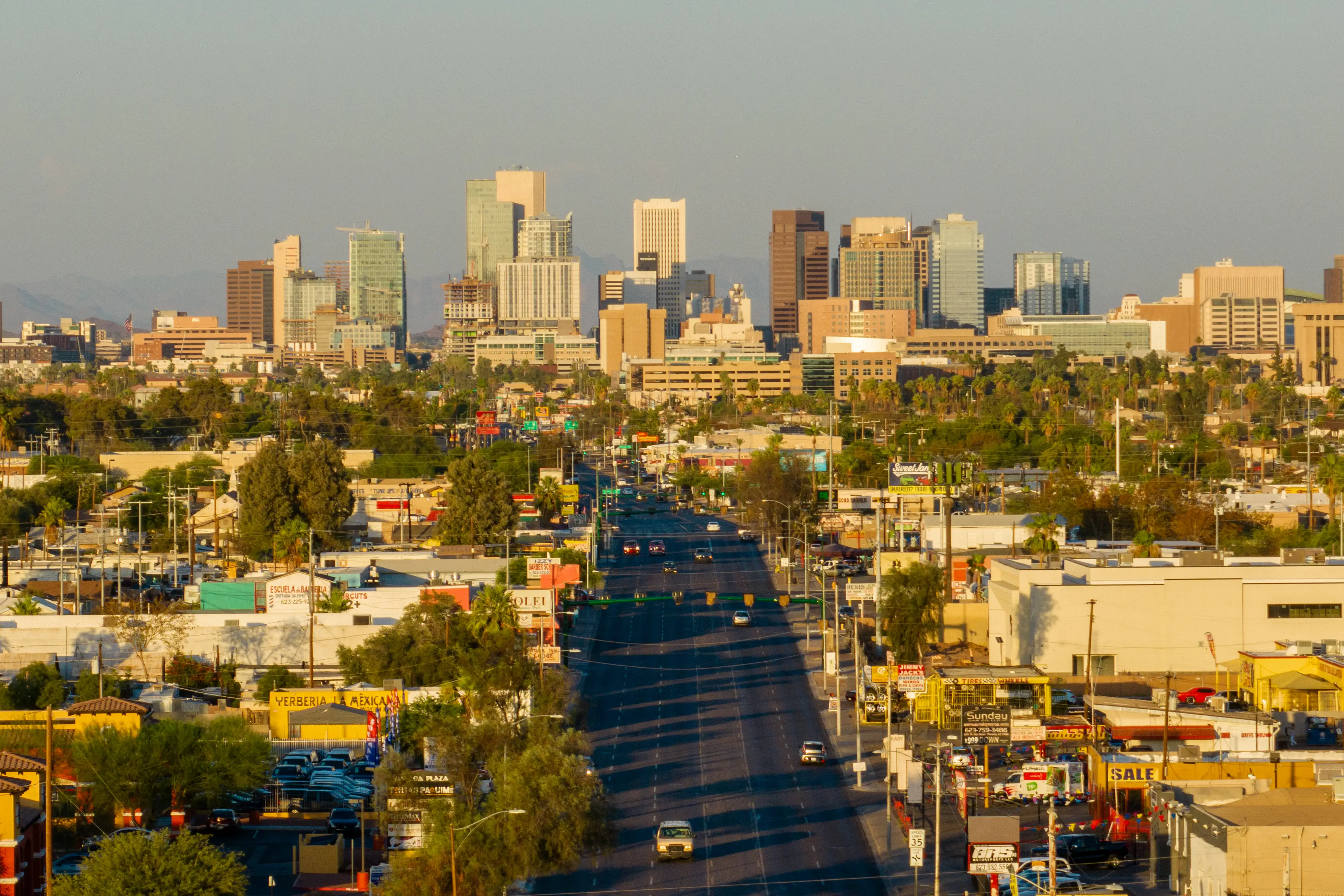 The skyline of a city at golden hour.