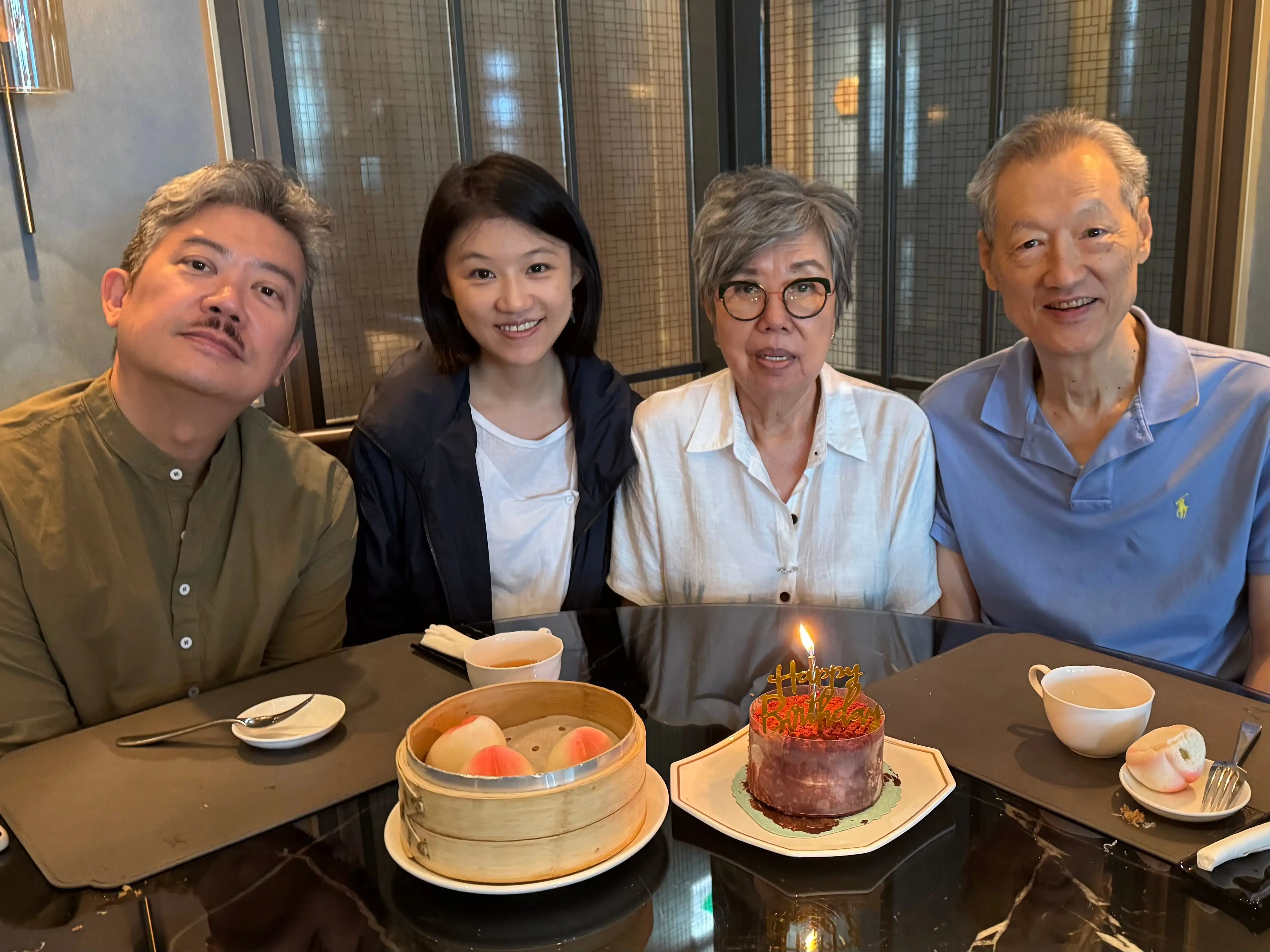 A man, a woman, and an older couple.